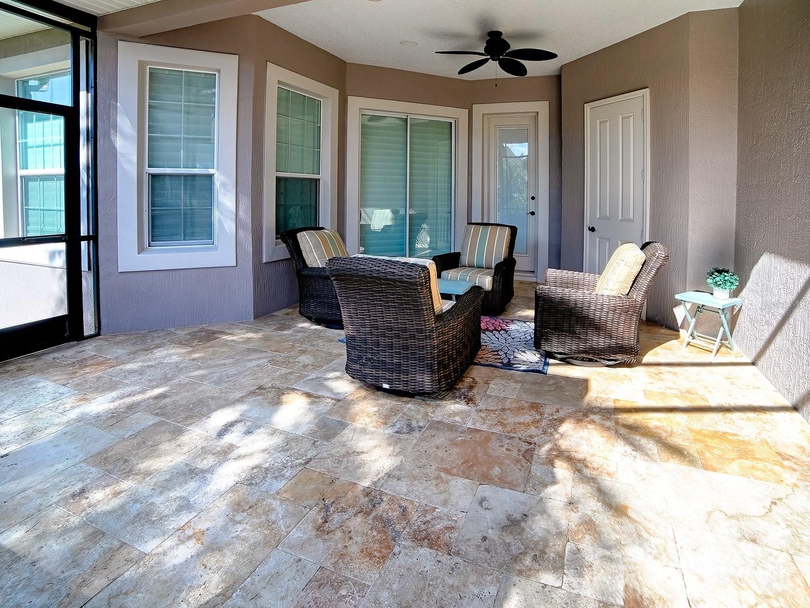 AROUND THE CORNER IS ANOTHER SEATING AREA, A STORAGE ROOM FOR ALL YOUR POOL EQUIPMENT, A POOL BATH AND THE SLIDING GLASS DOORS LEAD TO THE PRIMARY BED
