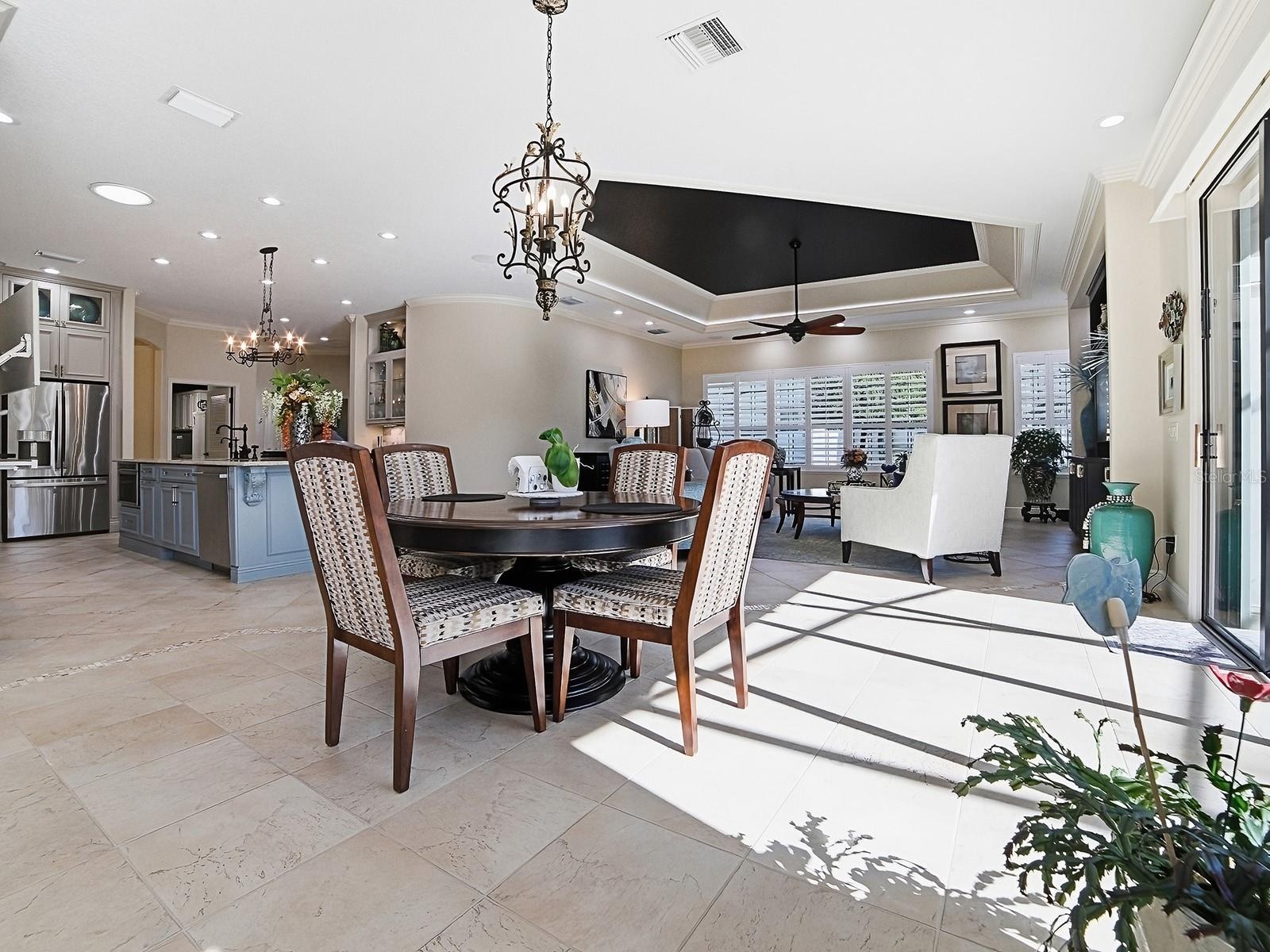 CASUAL DINING AREA OFF OF THE KITCHEN AND LARGE FAMILY ROOM.
