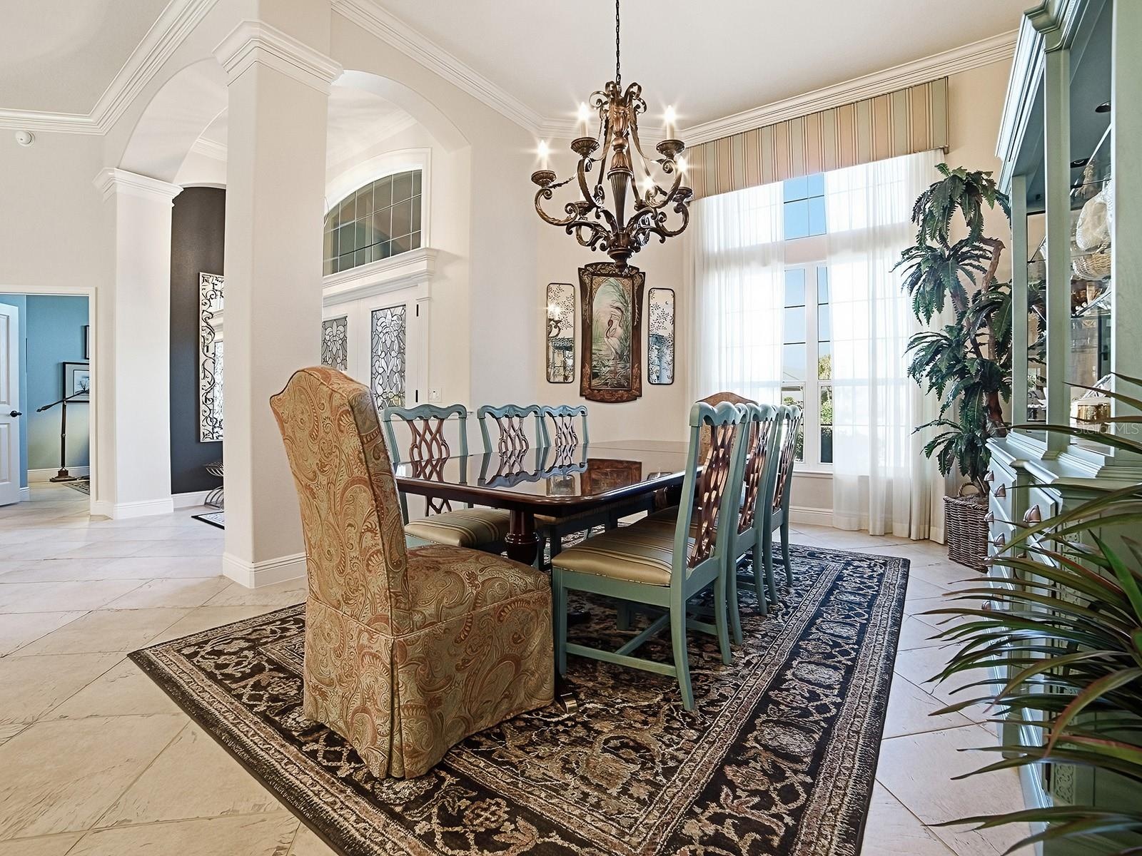 GREAT FOR ENTERTAINING WITH BEAUTIFUL CHANDELIER, VALANCE AND CUSTOM DRAPES.