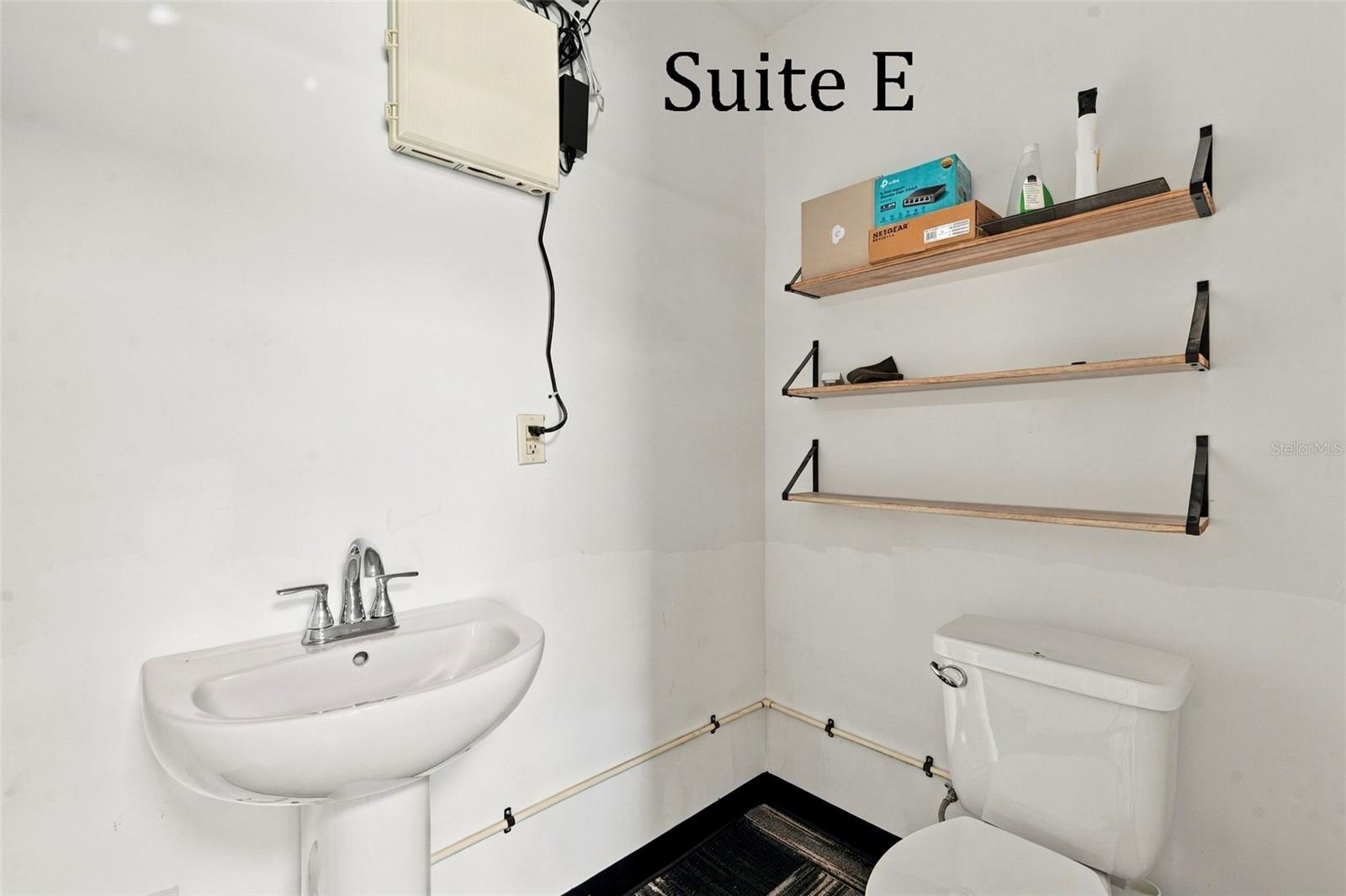 Suite E has a private entrance, large window overlooking the landscaping, a private restroom and has access to the Covered Patio Break Area