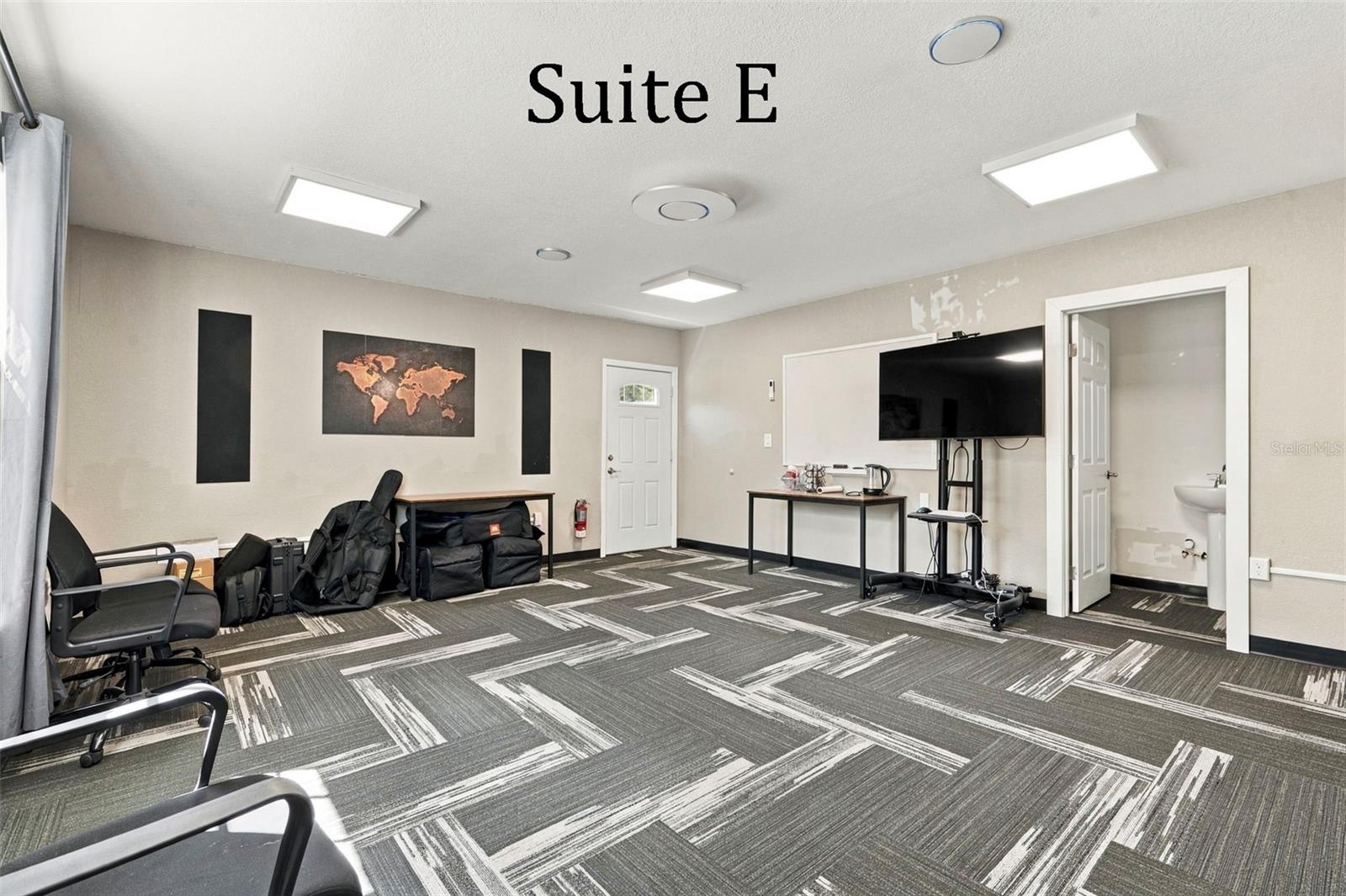 Suite E has a private entrance, large window overlooking the landscaping, a private restroom and has access to the Covered Patio Break Area