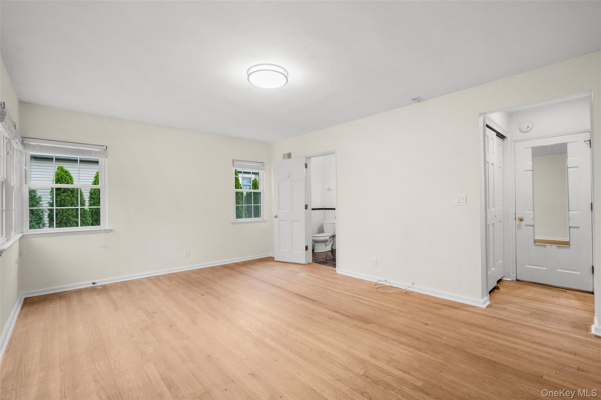 Spacious  Bedroom with 3 windows  and ensuite bath and 2 closets