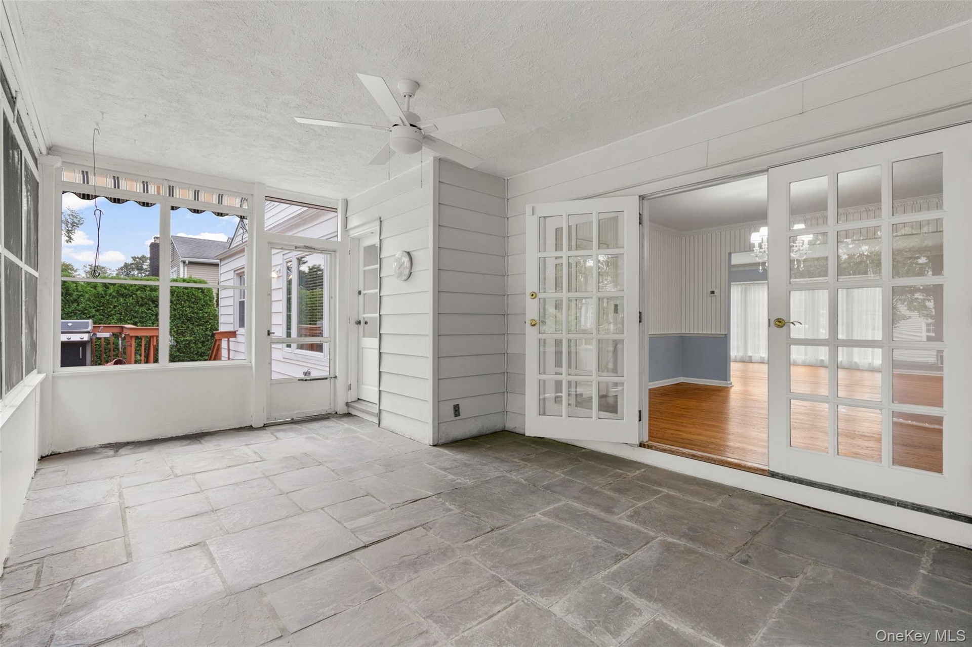 French doors opening to screened terrace