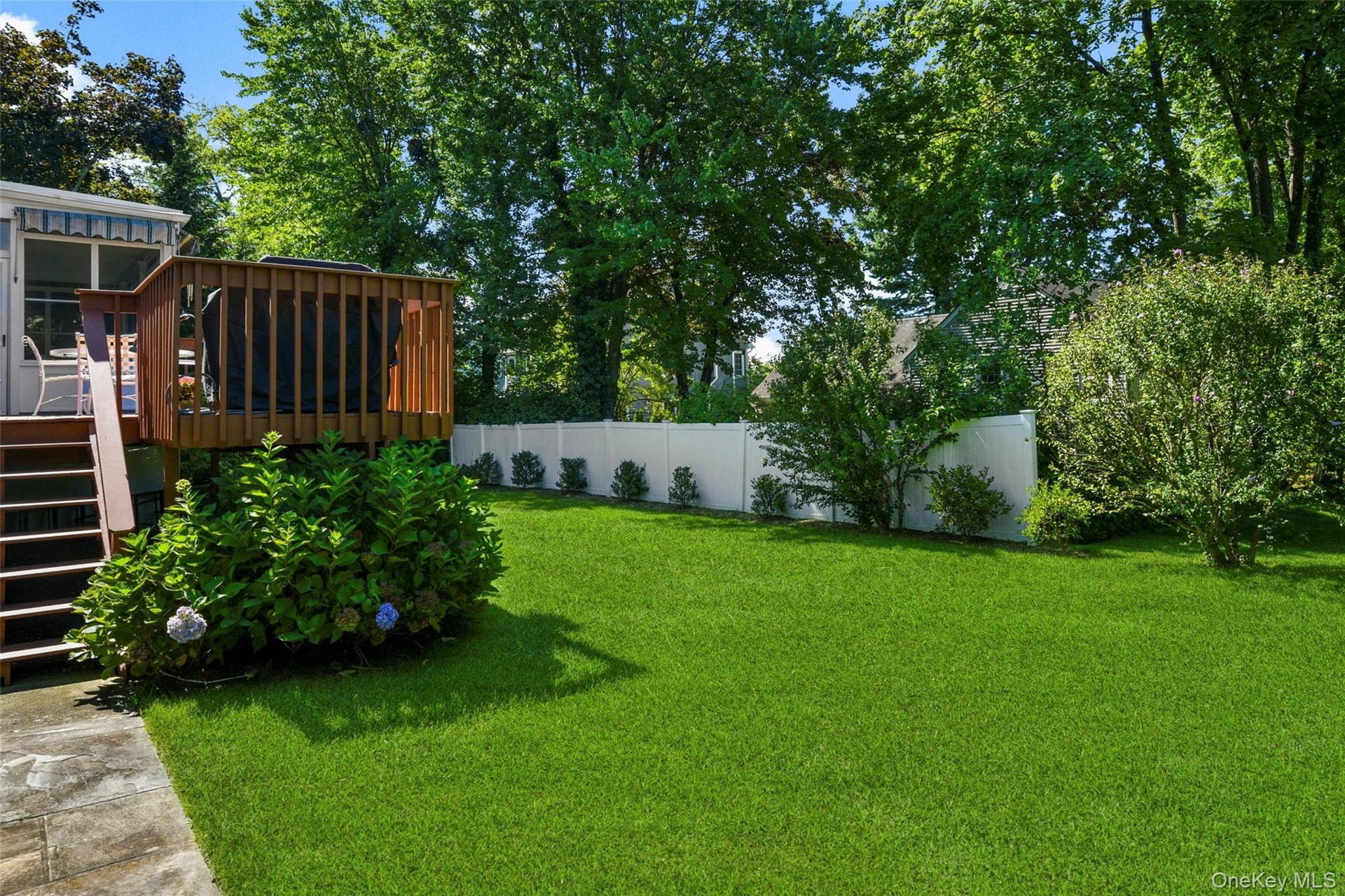 Beautiful backyard easily accessed by deck or lower level family room
