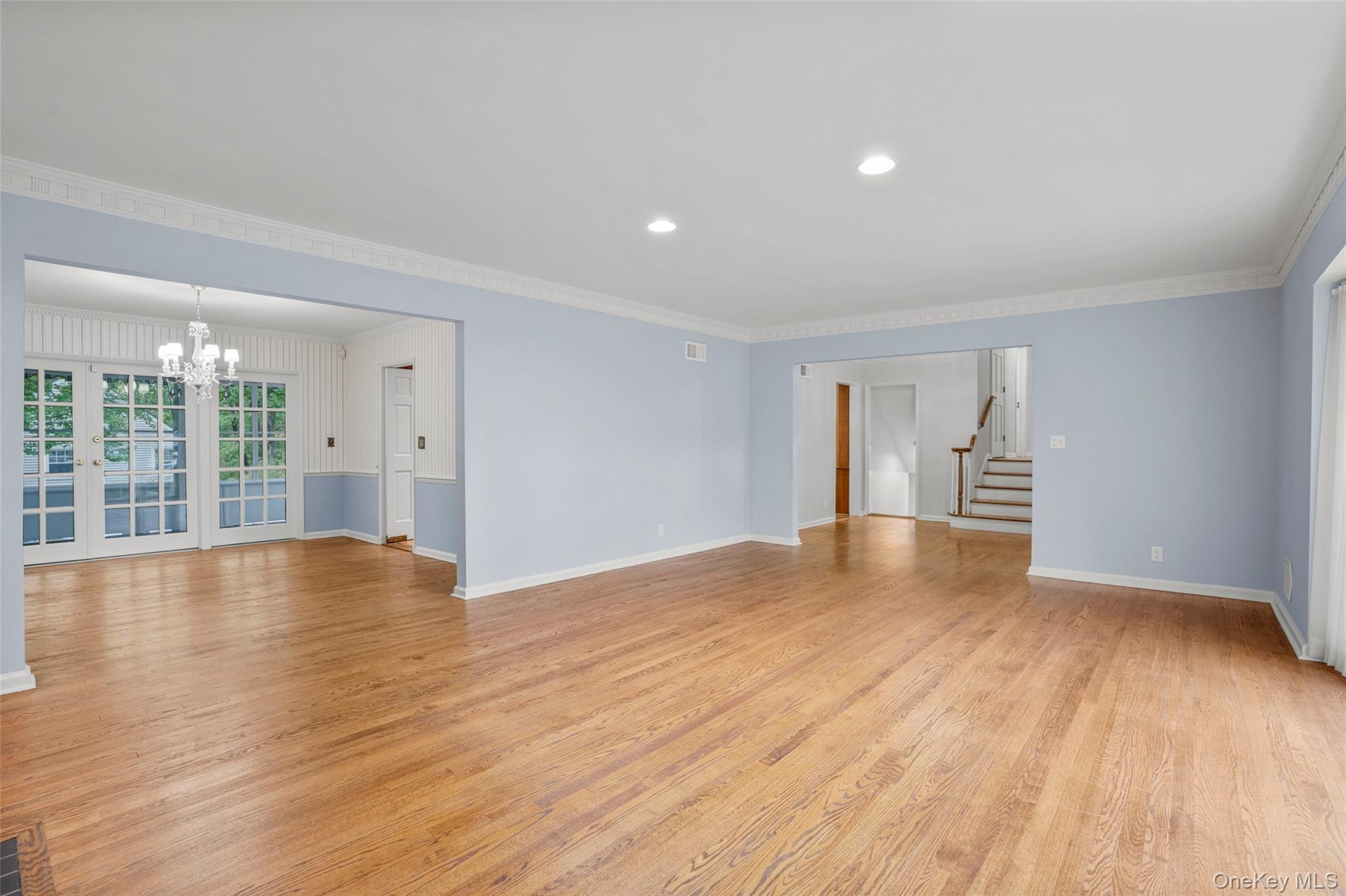 Living room opens to large dining room, ideal for entertaining