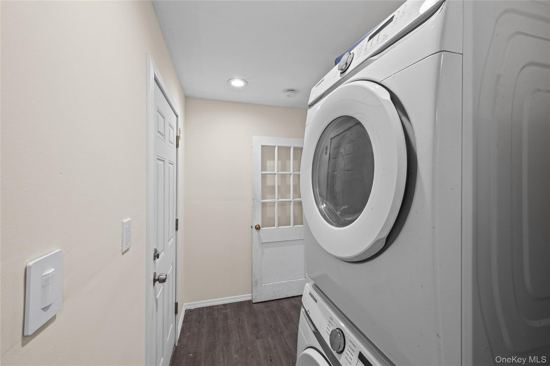 Washer/dryer located off of kitchen. Leads to 4th bedroom and office space. Door to garage