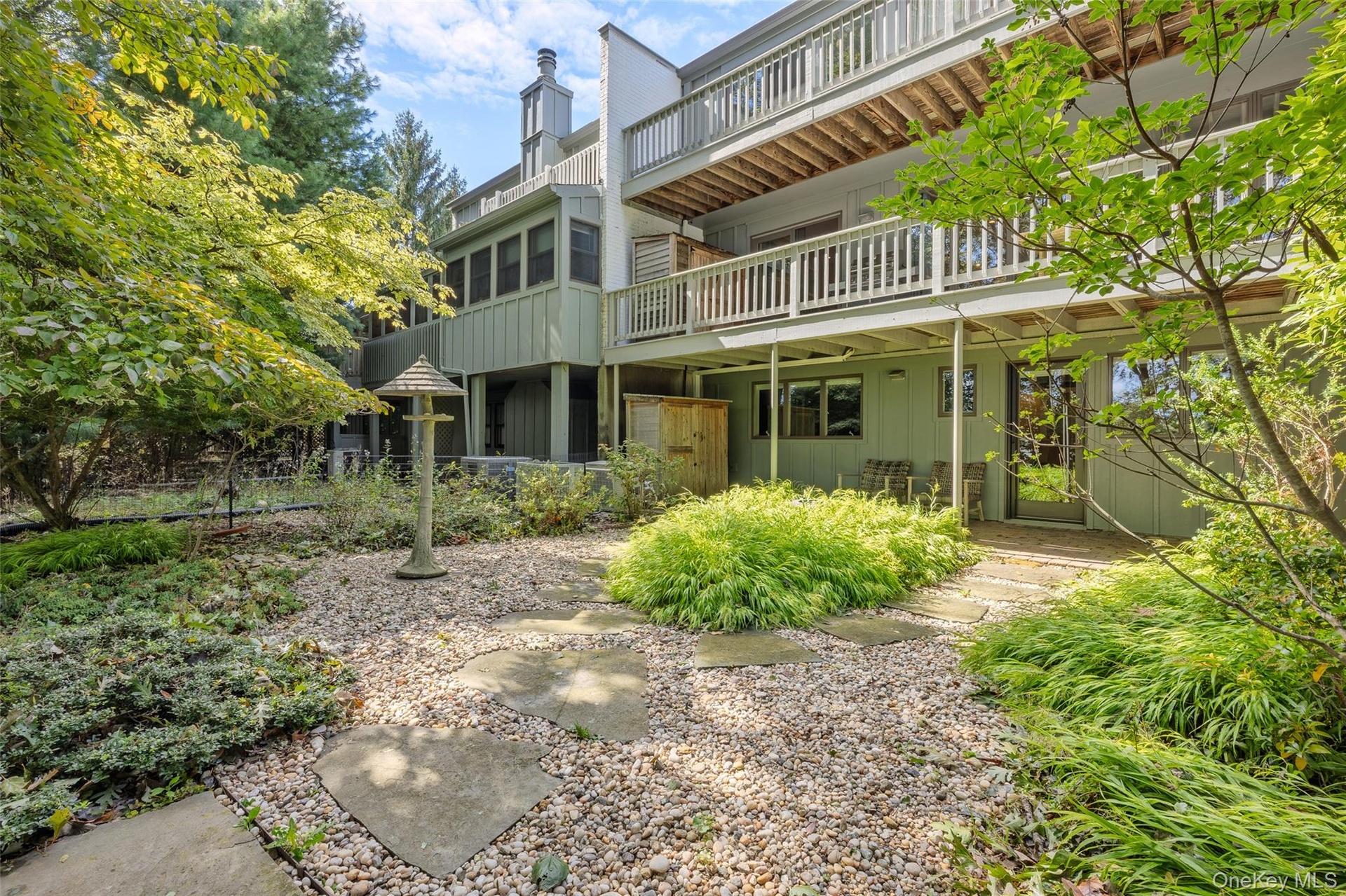 Back of structure features 3 levels of outdoor entertaining space