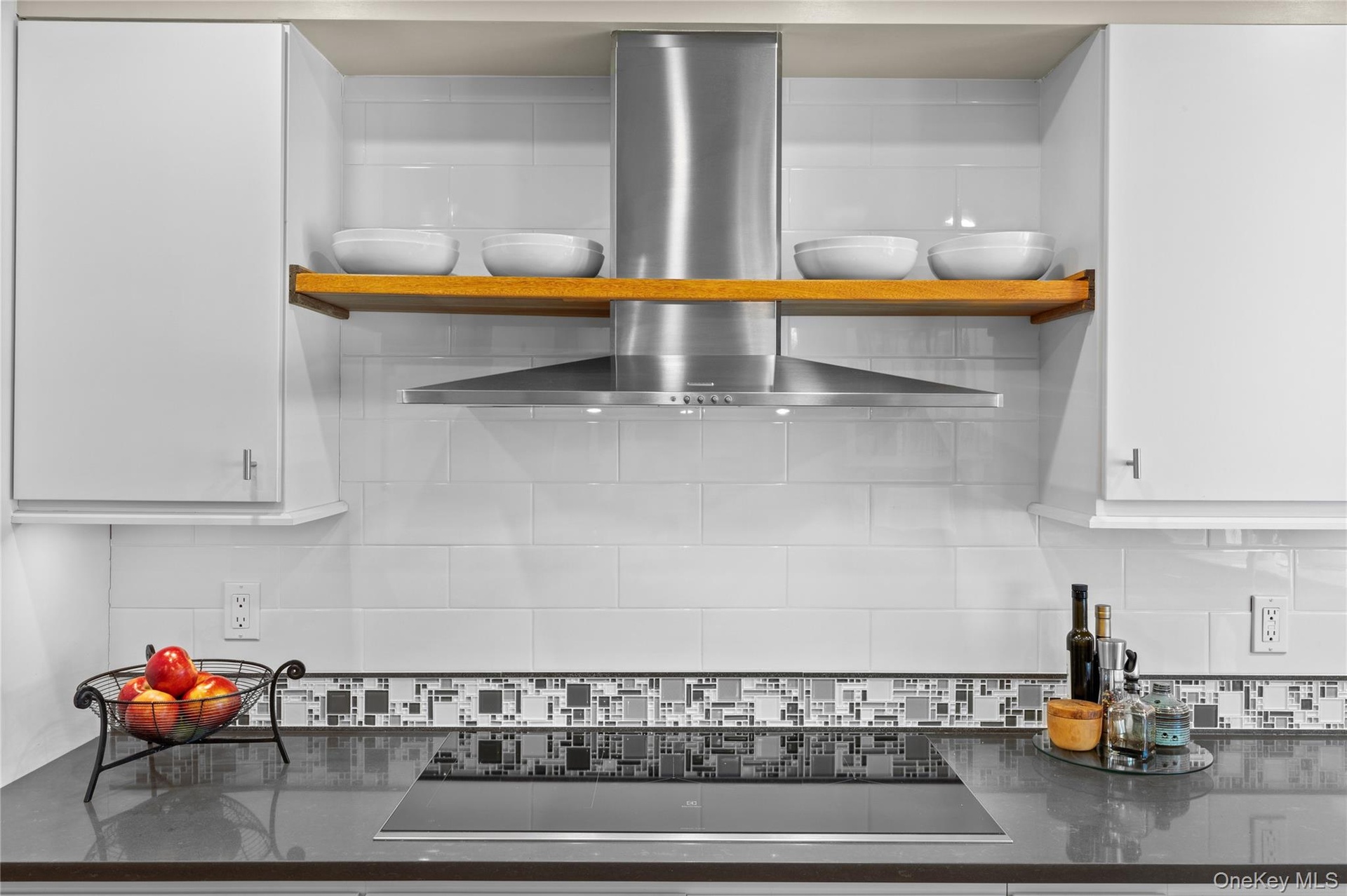 Furniture grade custom cabinetry with tile backsplash and every amenity