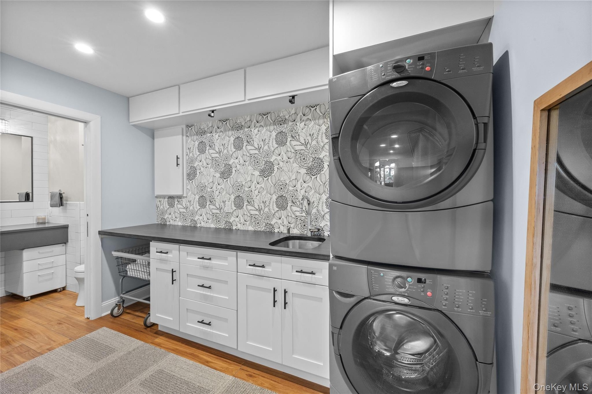 Laundry area with built in counters and shelving