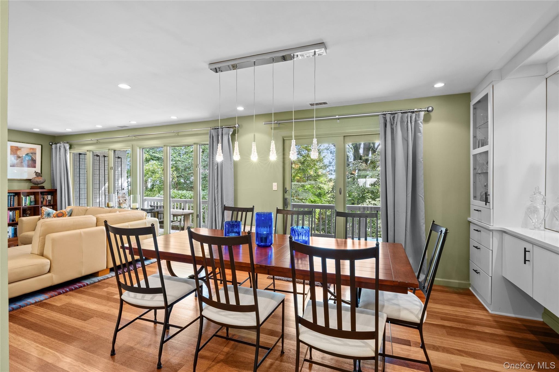 Dining room with custom built in buffet and sliding glass doors to expansive rear deck