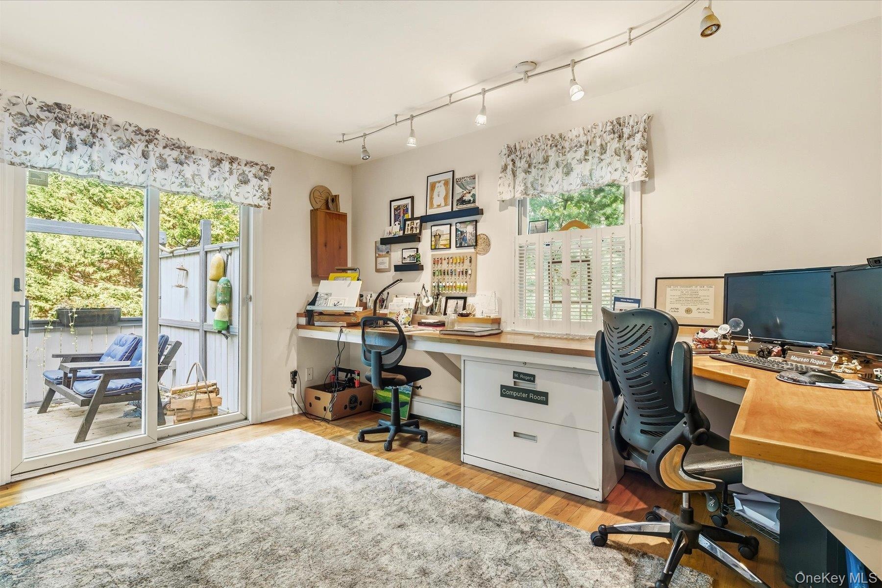 office/Possible 5th bedroom, sliding glass door to deck, hardwood flooring