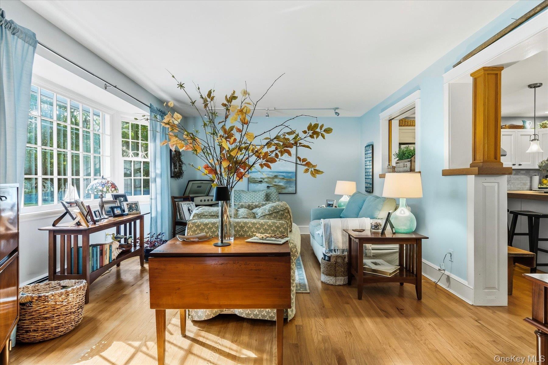 Bay window with multiple panes, hardwood flooring