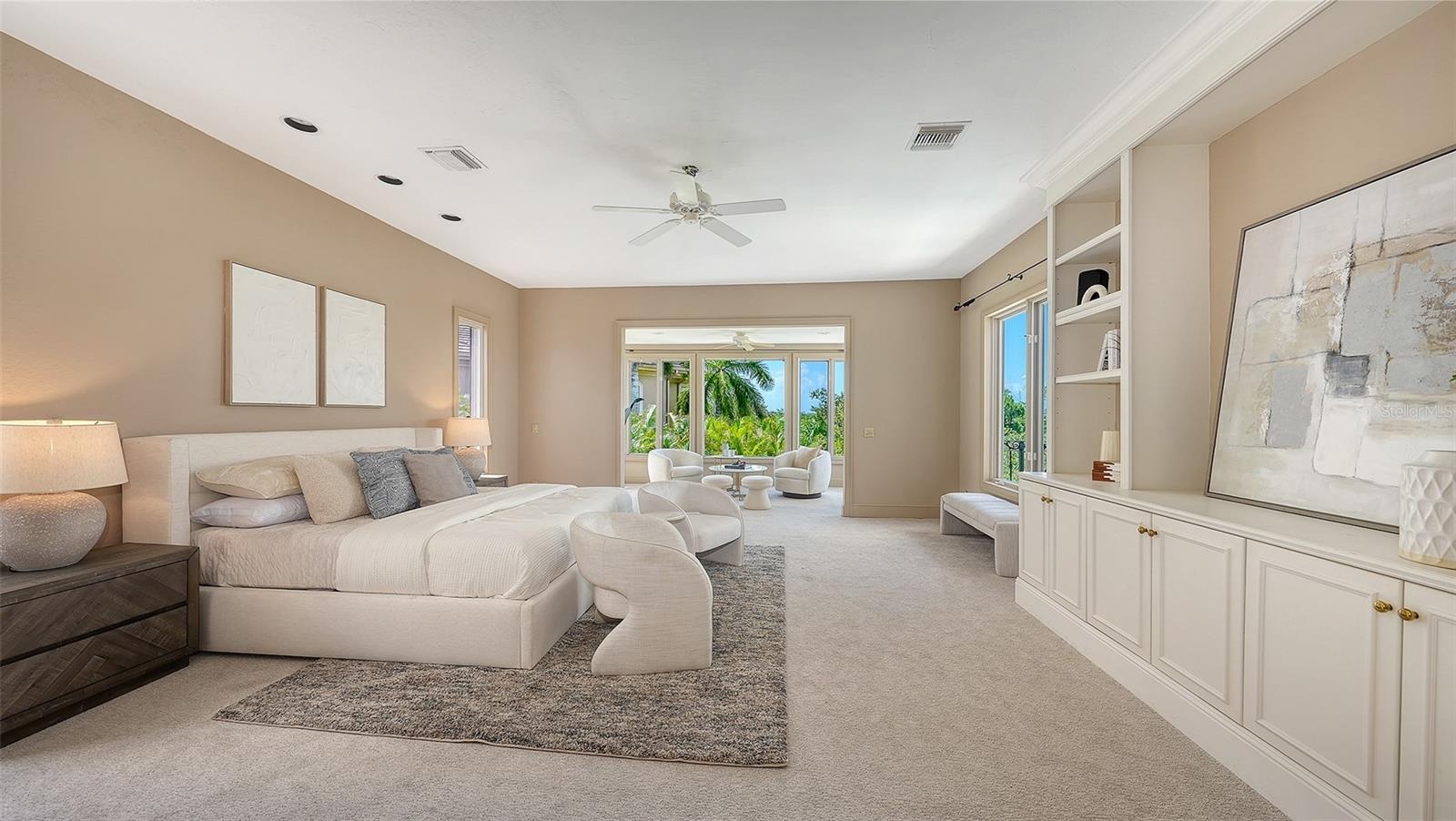 The primary suite occupies its own private level with generous proportions, custom built ins and a separate sitting area.