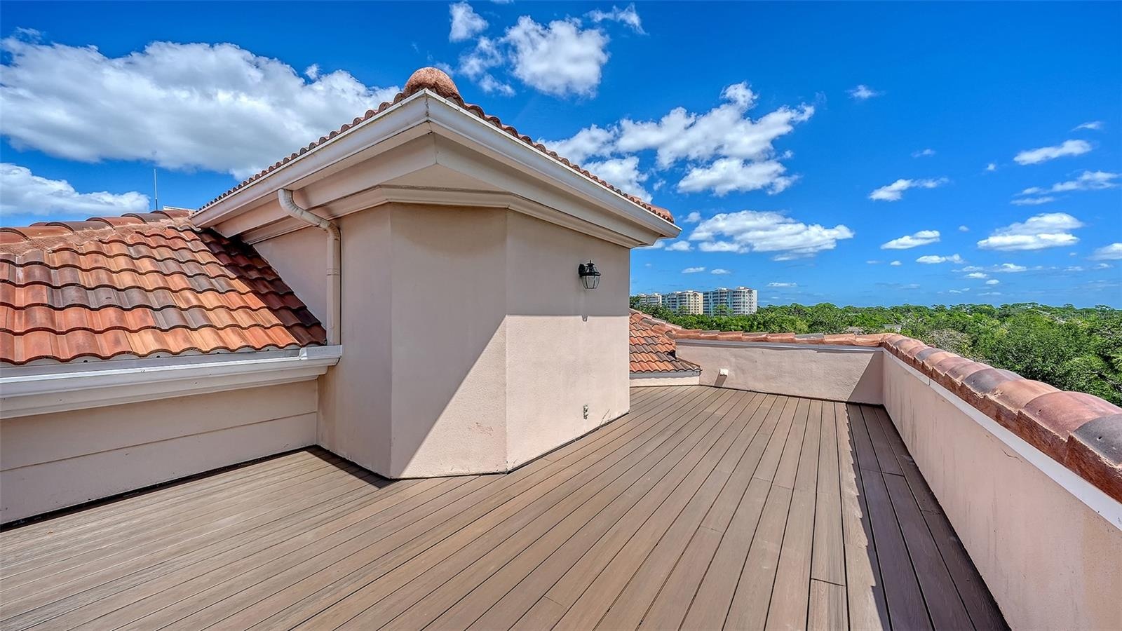 Enjoy open skies, bay breezes and a spectacular perspective from the home's rooftop terrace.