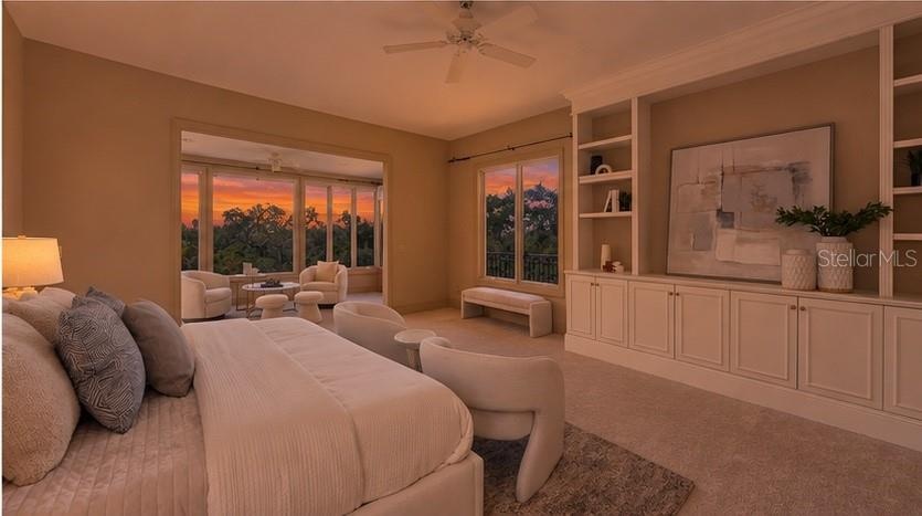 Expansive windows bring dramatic sunset colors directly into the private primary retreat.