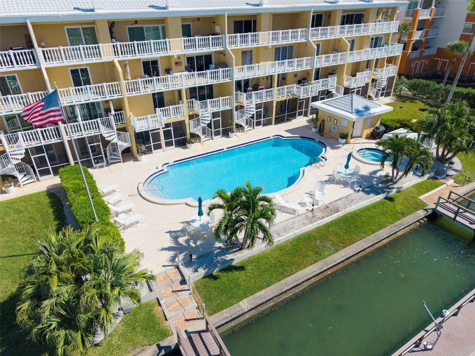 Aerial View NOTE the circular staircases that run from the unit to pool level & lounge area