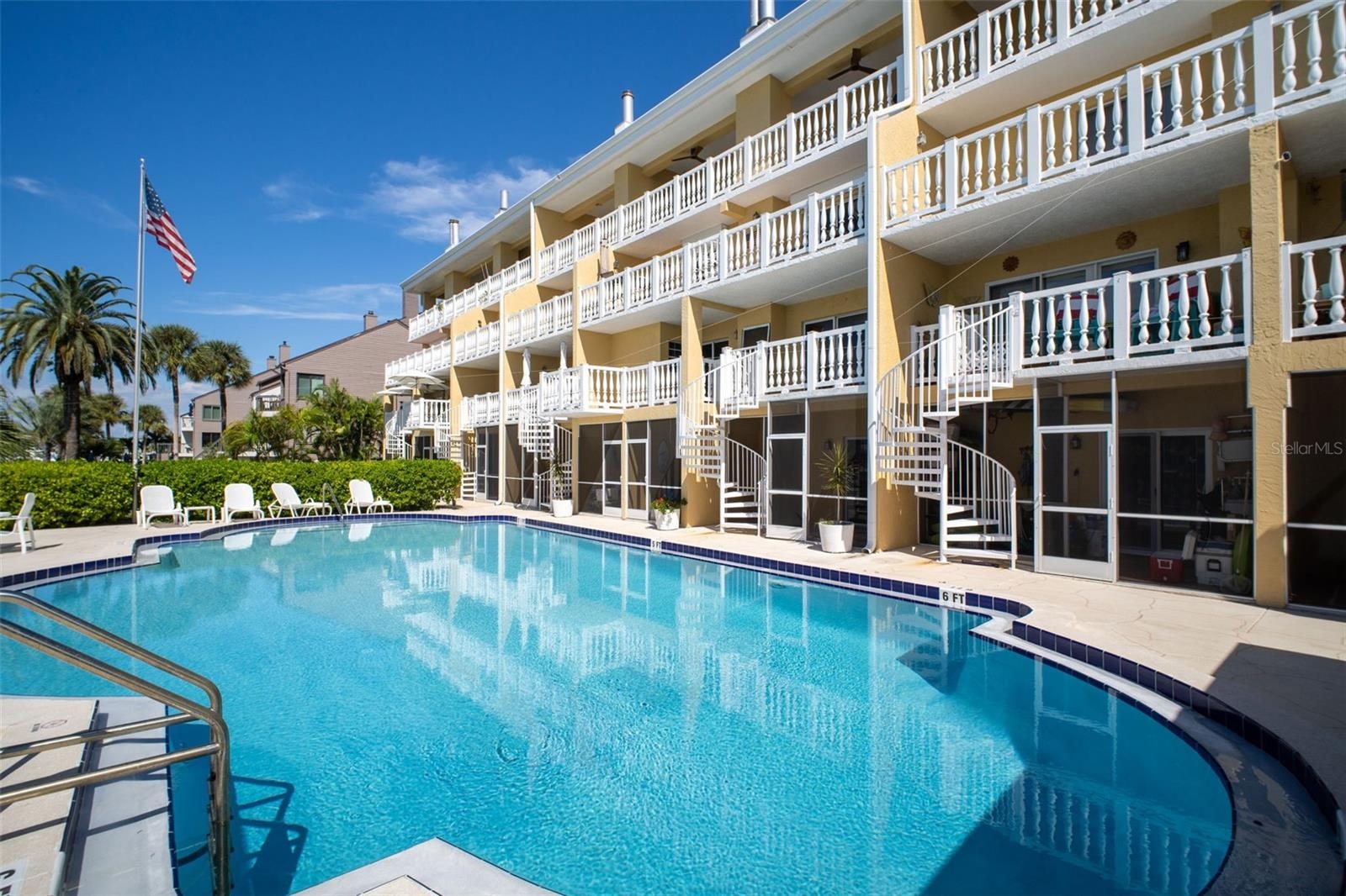 NOTE the circular staircases that runs from the unit balcony down to the pool area and private lounge area.