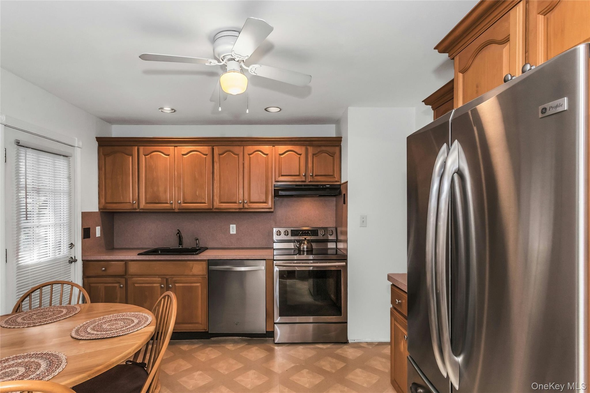 Kitchen With Maple Cabinets and Stainless Steel Appliances