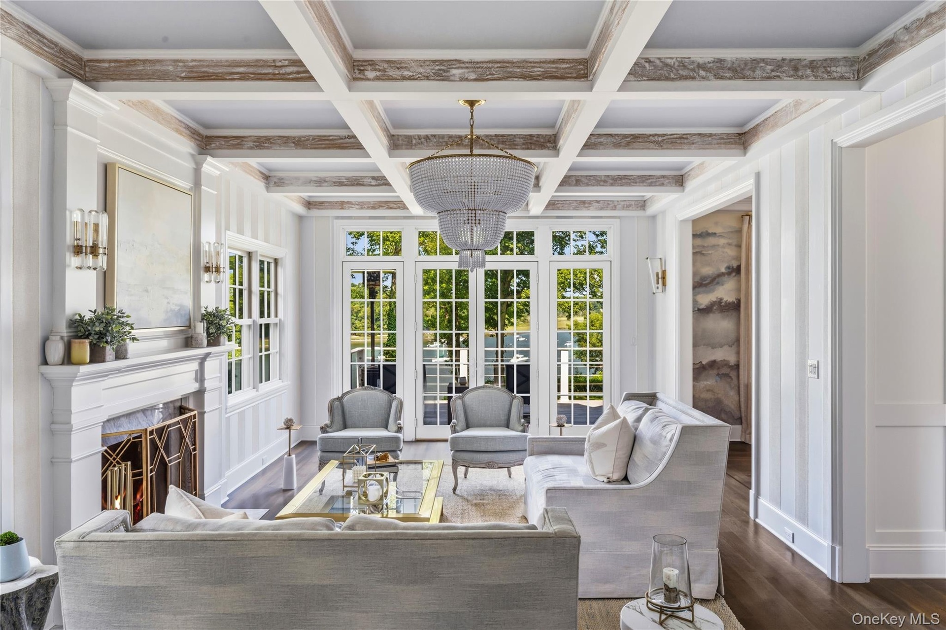 Coffered ceiling with wood-finish beams, and wood burning fireplace.