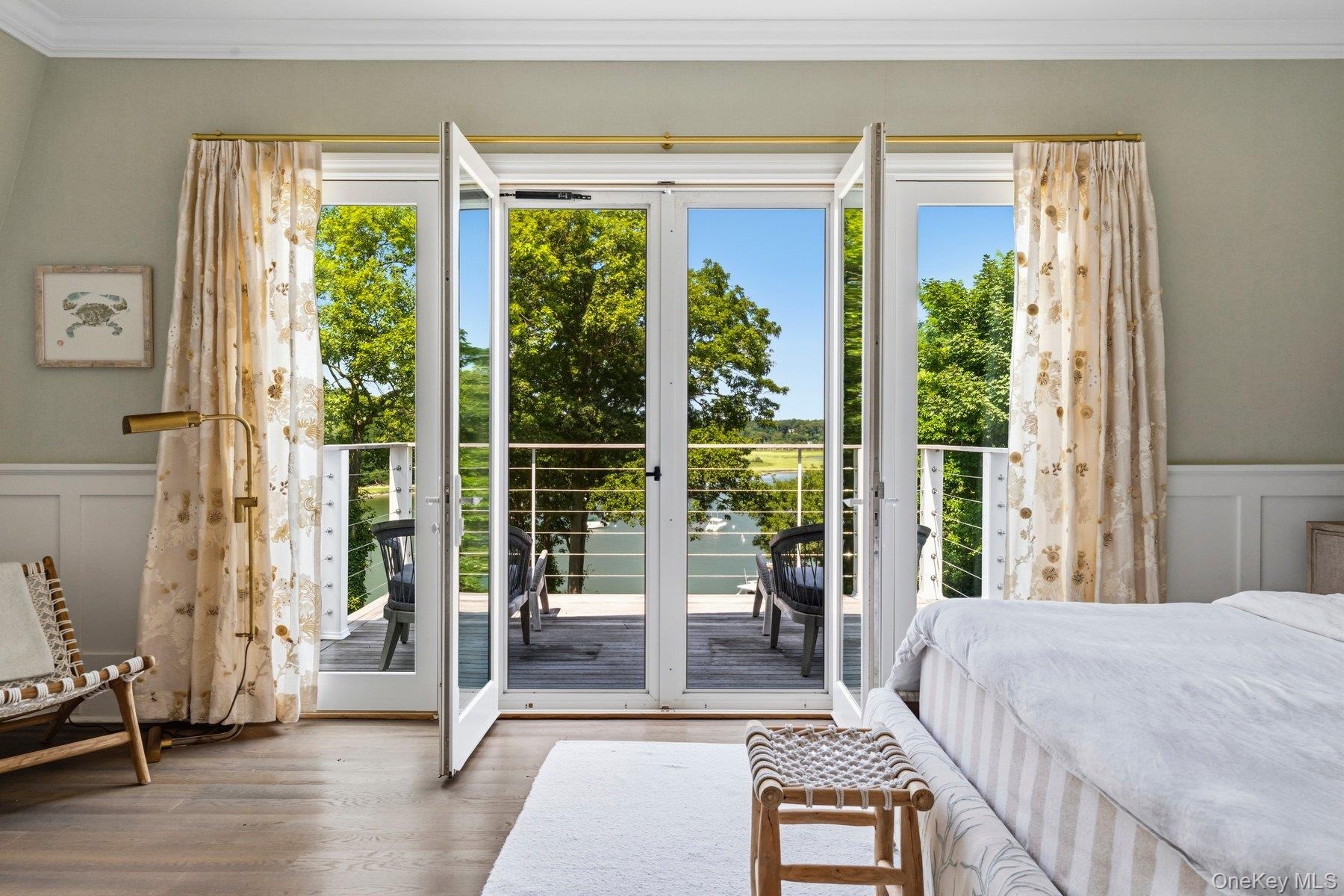 French doors open to waterfront balcony
