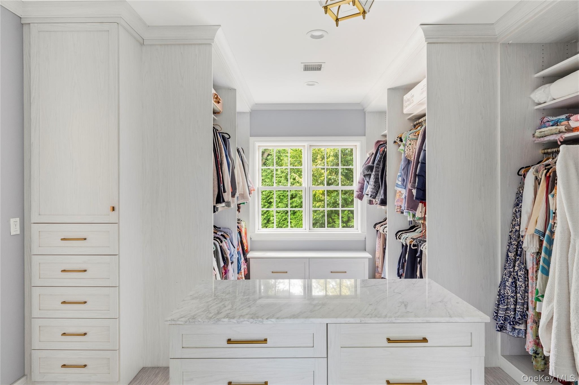 Custom built-in cabinetry, center island with stone countertop