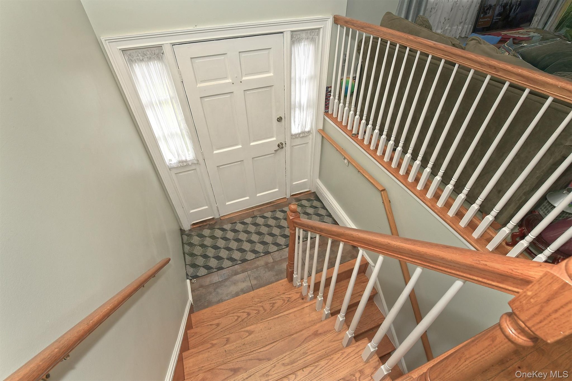 Oak Stairs, Rails leads to Entry Foyer