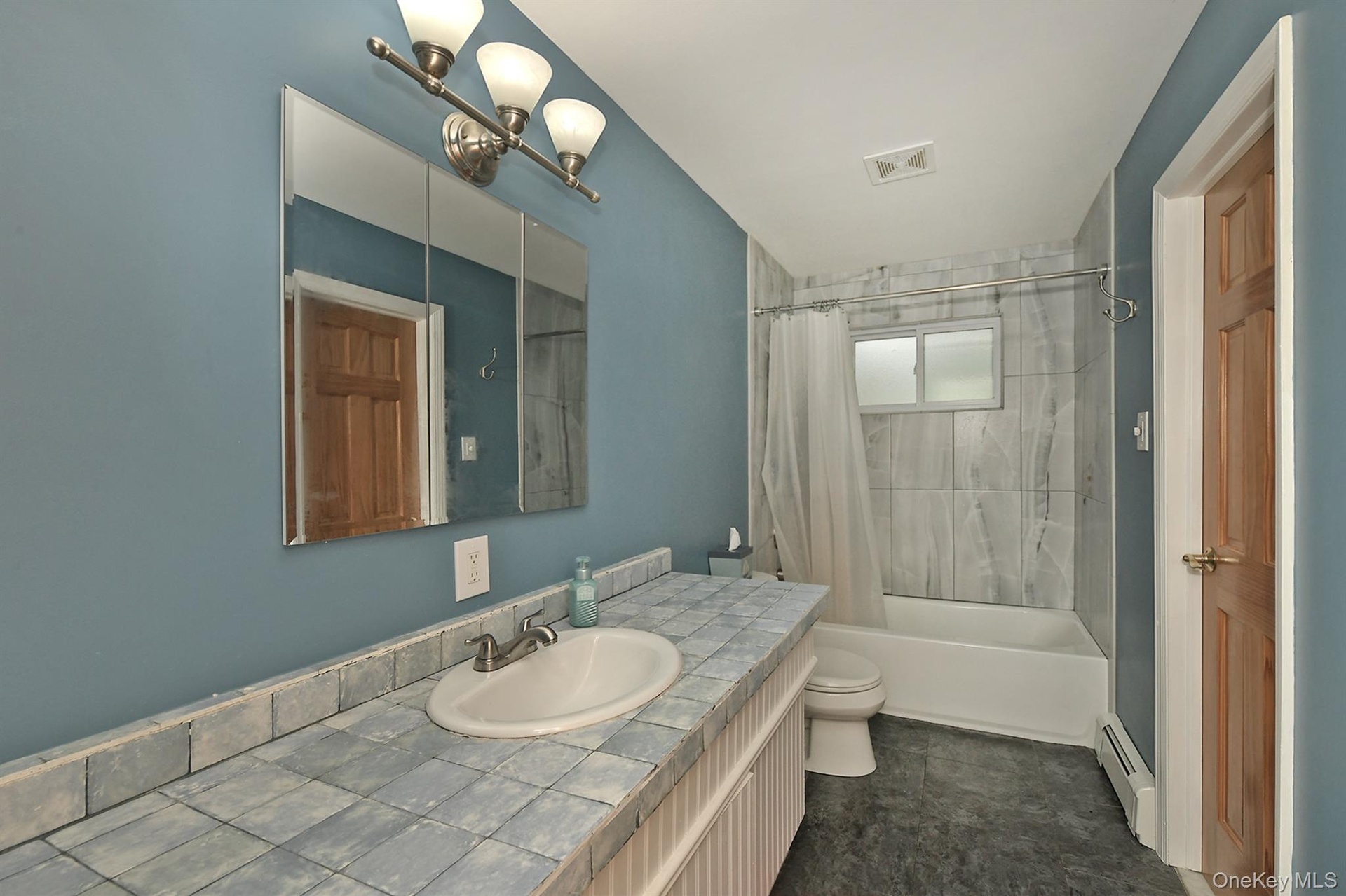 Upper Remodeled bath includes Tub, Window, Toilet, Tiles