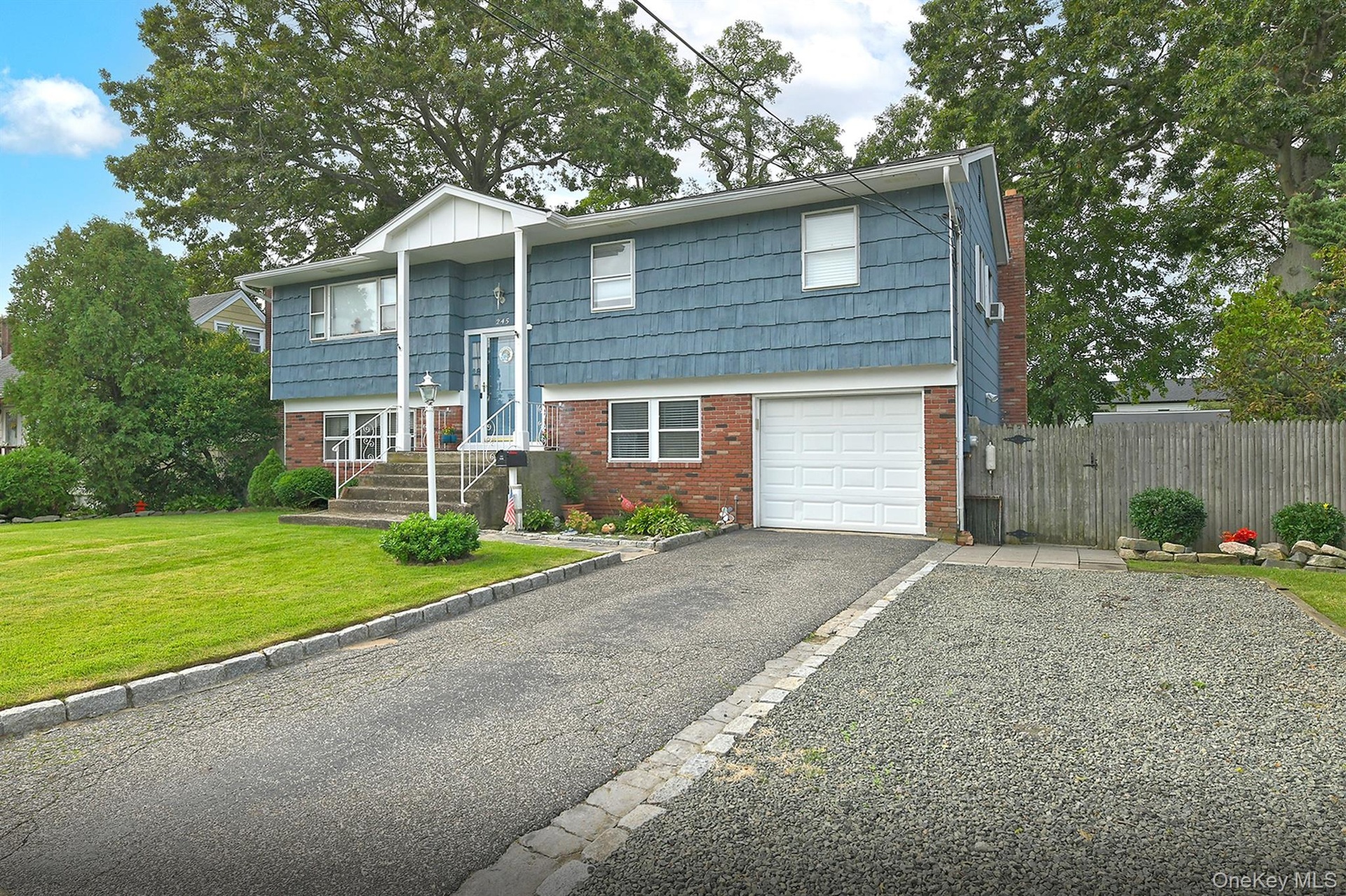 Front View with Extended Oversize Driveway and 1 Car Garage