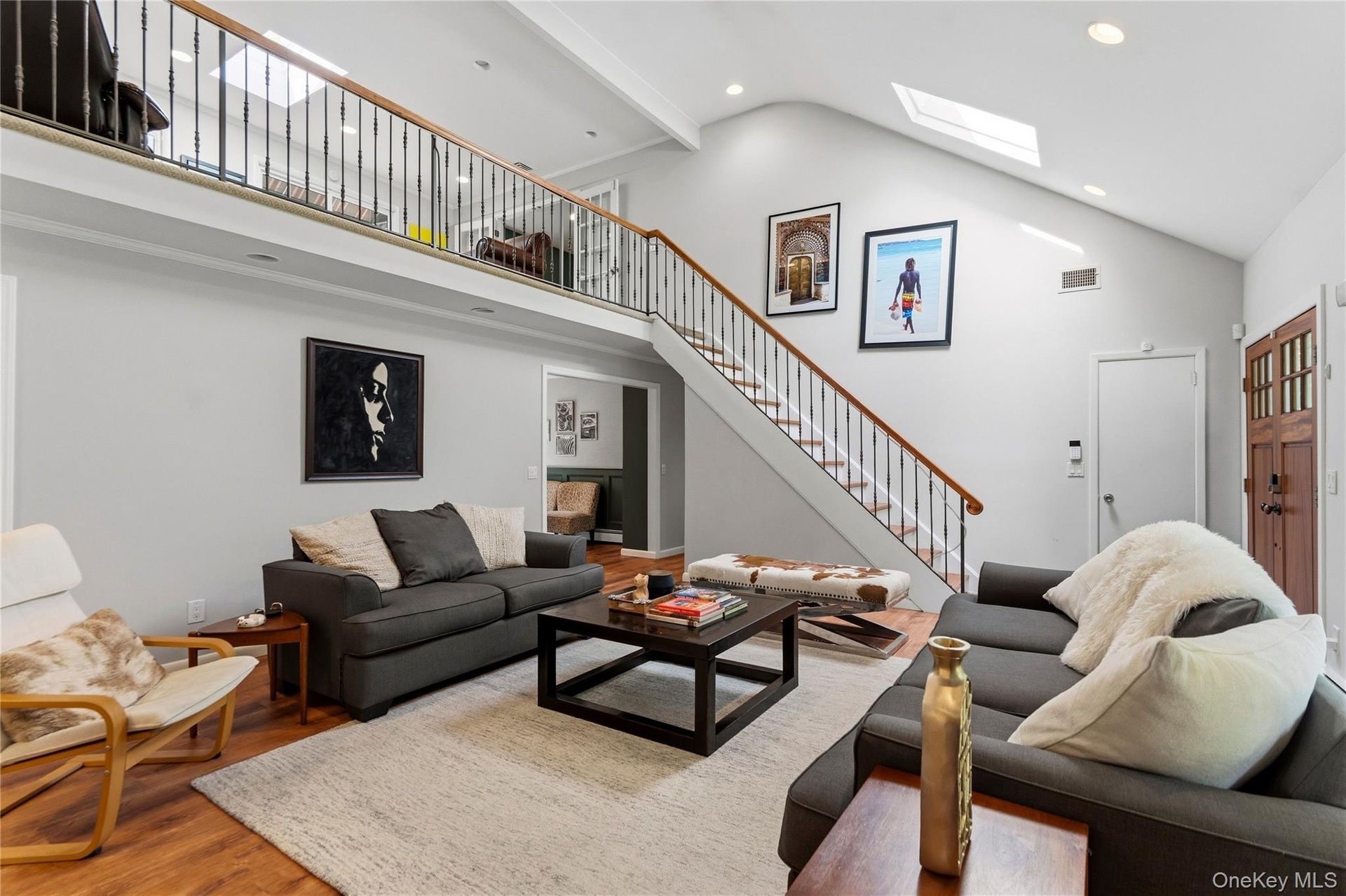 Entry with View of Stairs and Loft with 2 Skylights