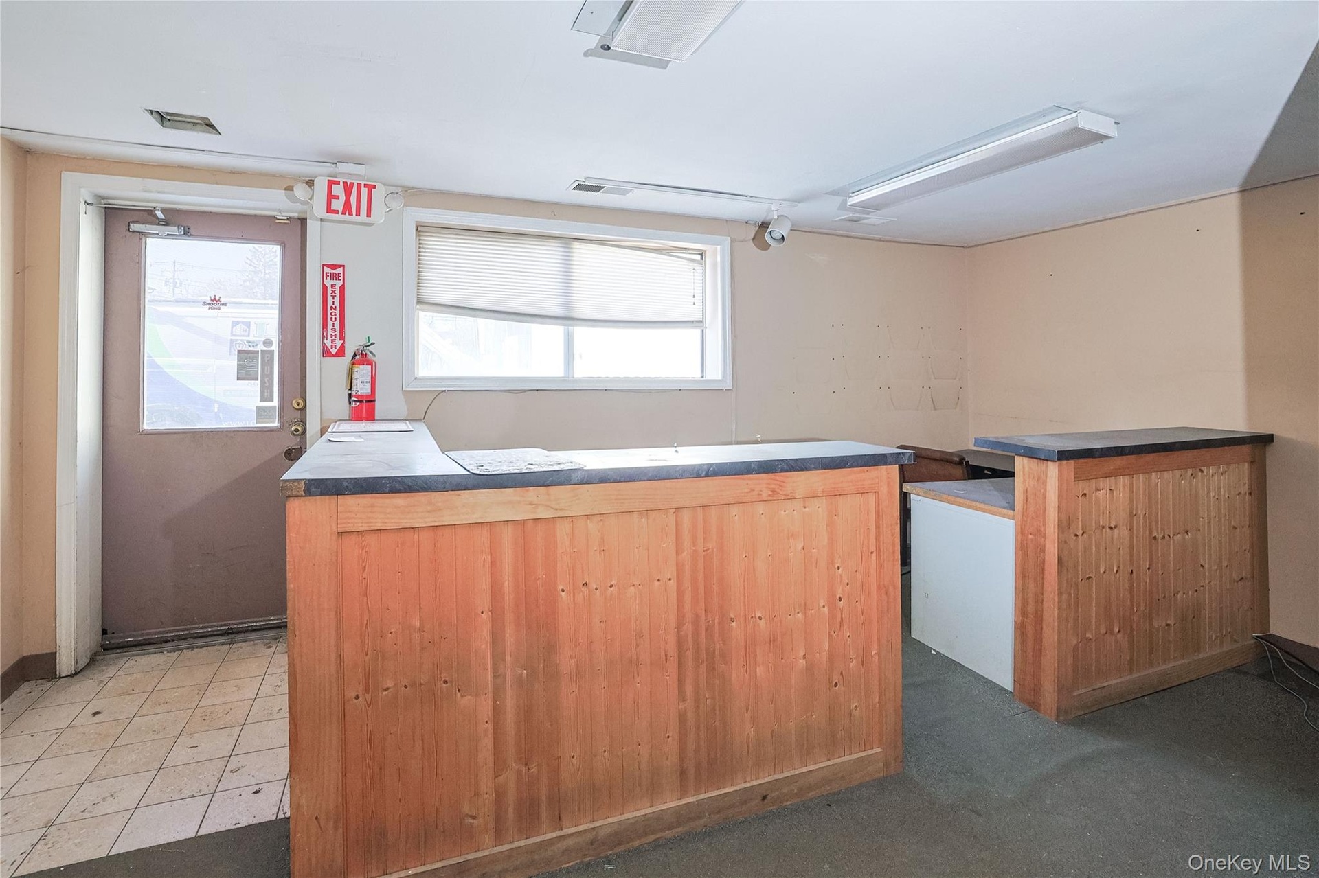 Kitchen featuring dark countertops and a kitchen island