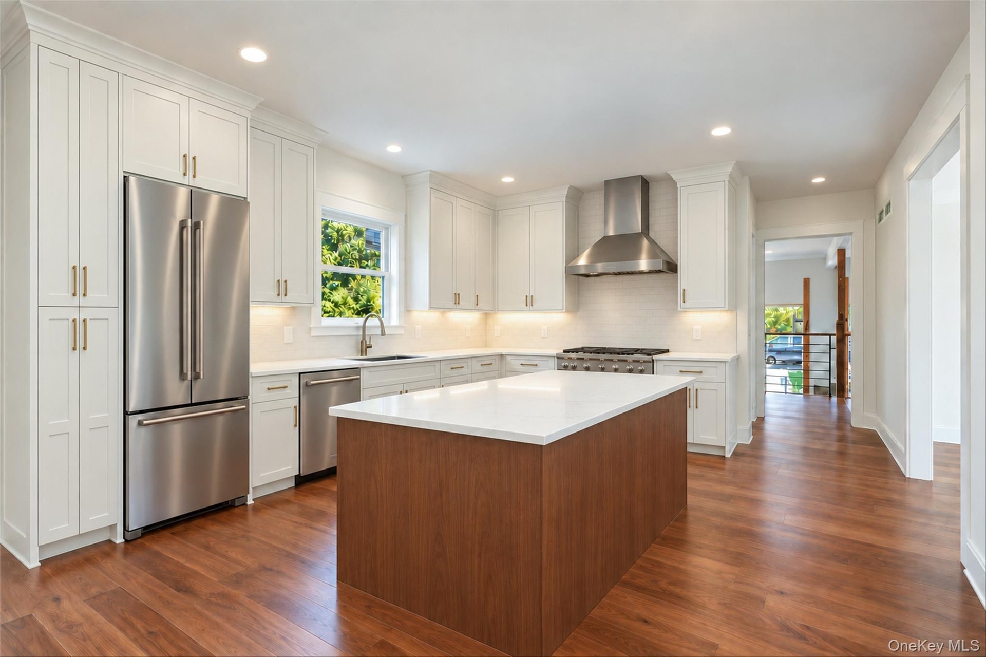 Virtually Staged - Kitchen. First Floor will have hardwoods. Kitchen cabinets in white/dove color. Island will be similar to the hardwoods.
