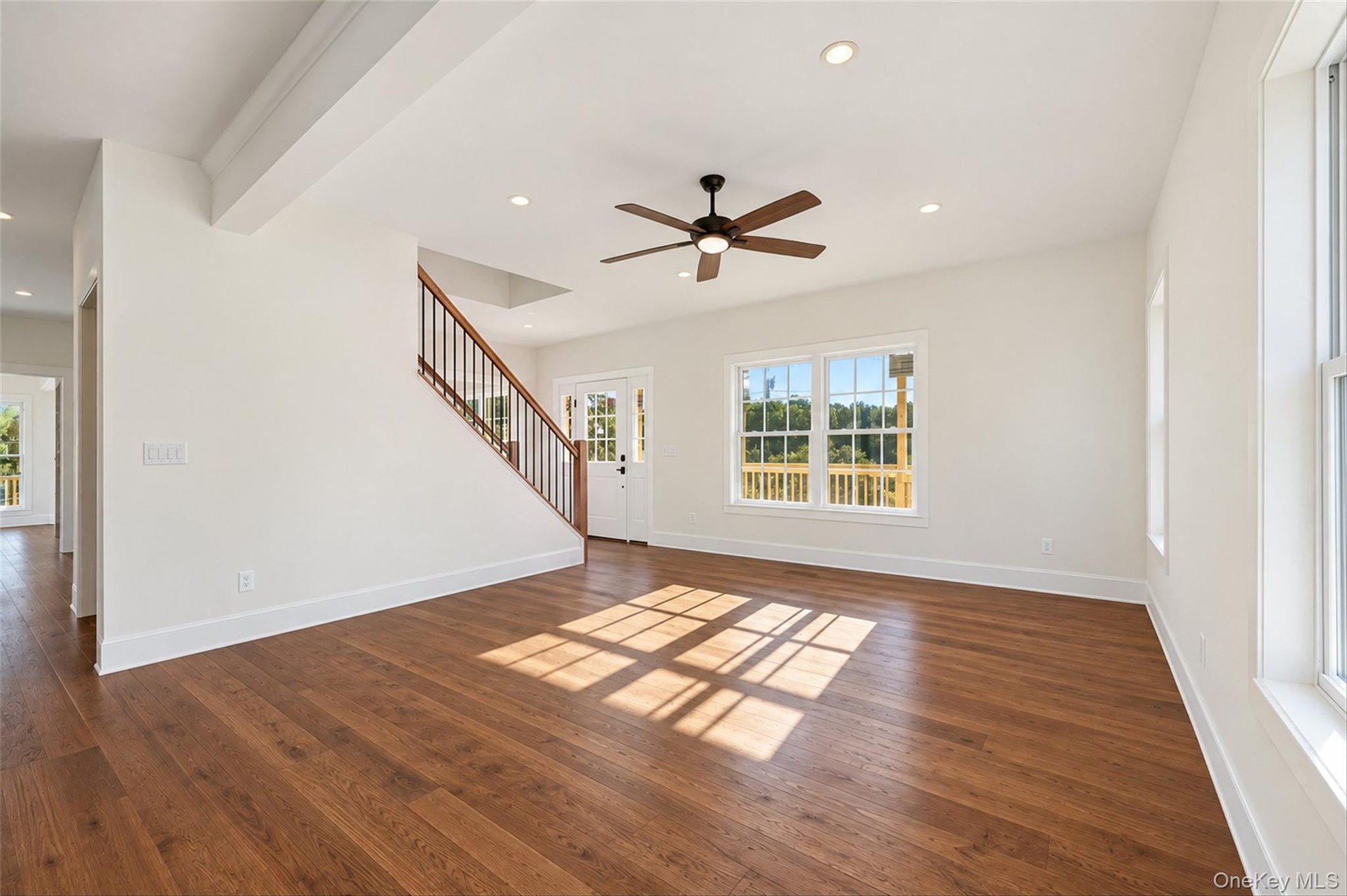 Virtually Staged - Living Room. First Floor will have hardwoods. Railings will have black spindles and oak railing.