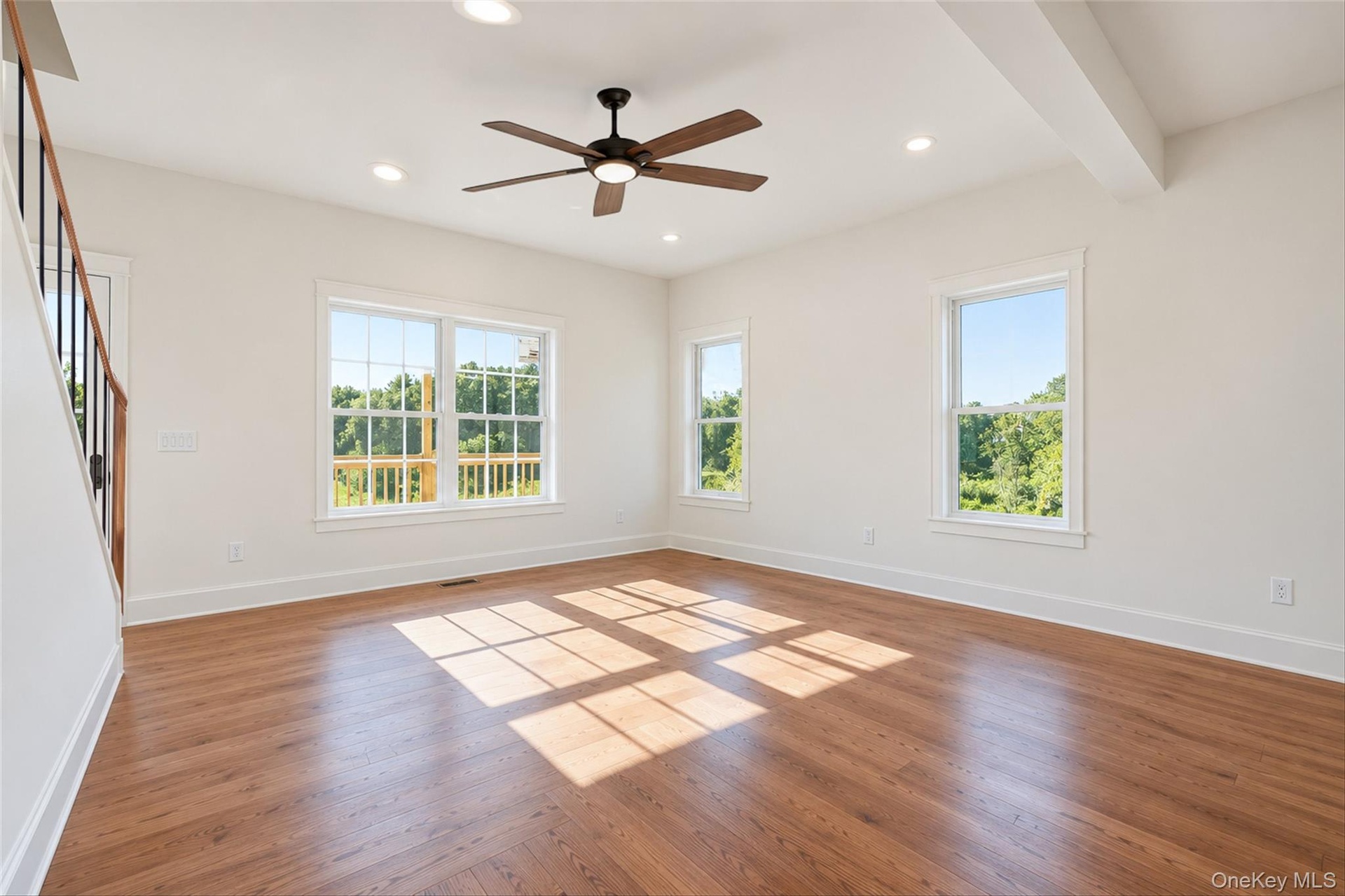Virtually Staged - Living Room. First Floor will have hardwoods. Railings will have black spindles and oak railing.