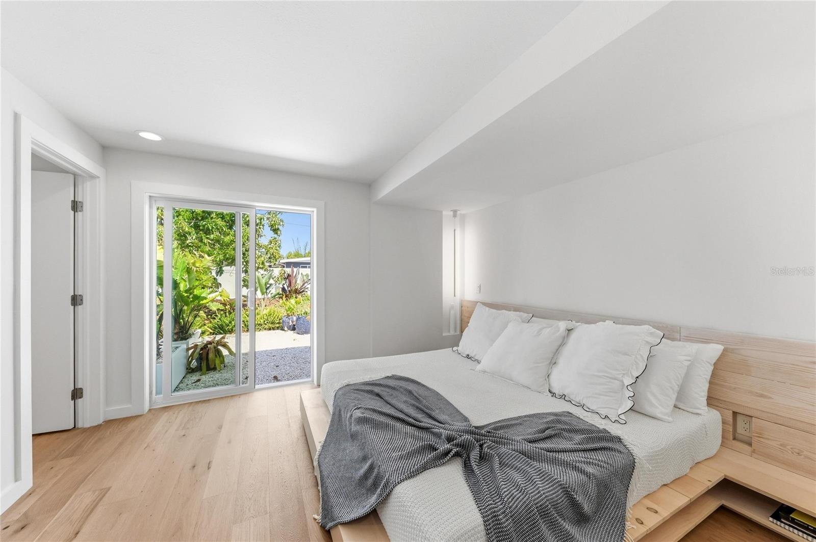 The Master Bedroom with en-suite bath and direct access to the garden.