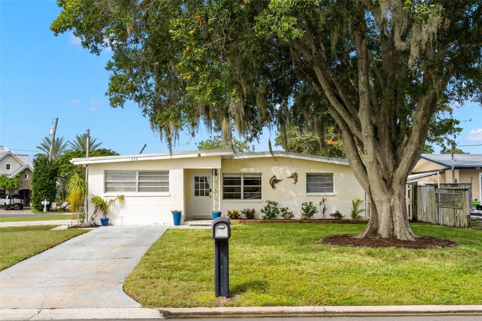 Set on an impressive 11,800-square-foot (.27-acre) corner property spanning one full lot plus half of the adjoining lot, this 3-bedroom, 2-bath Palm H