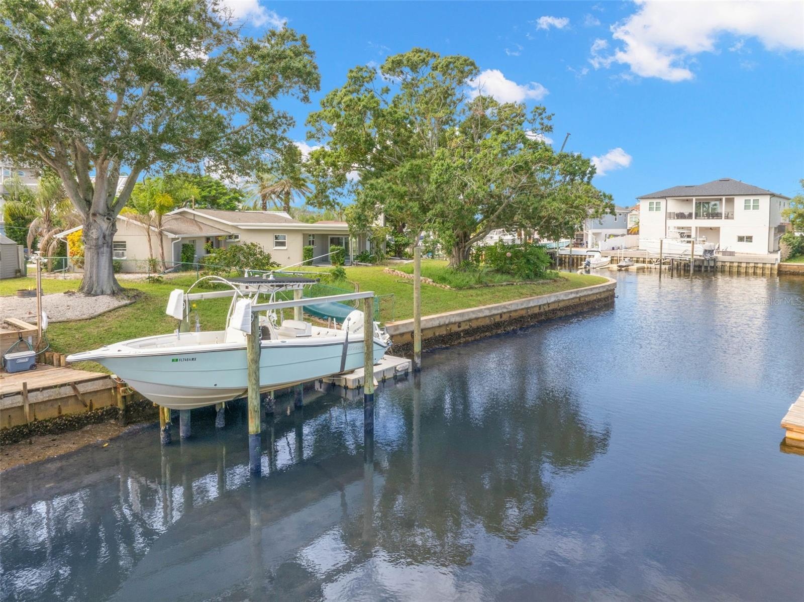 Set along a saltwater canal with Gulf access and no fixed bridges, the property’s 10,000-pound boat lift puts you just steps from getting out on the w