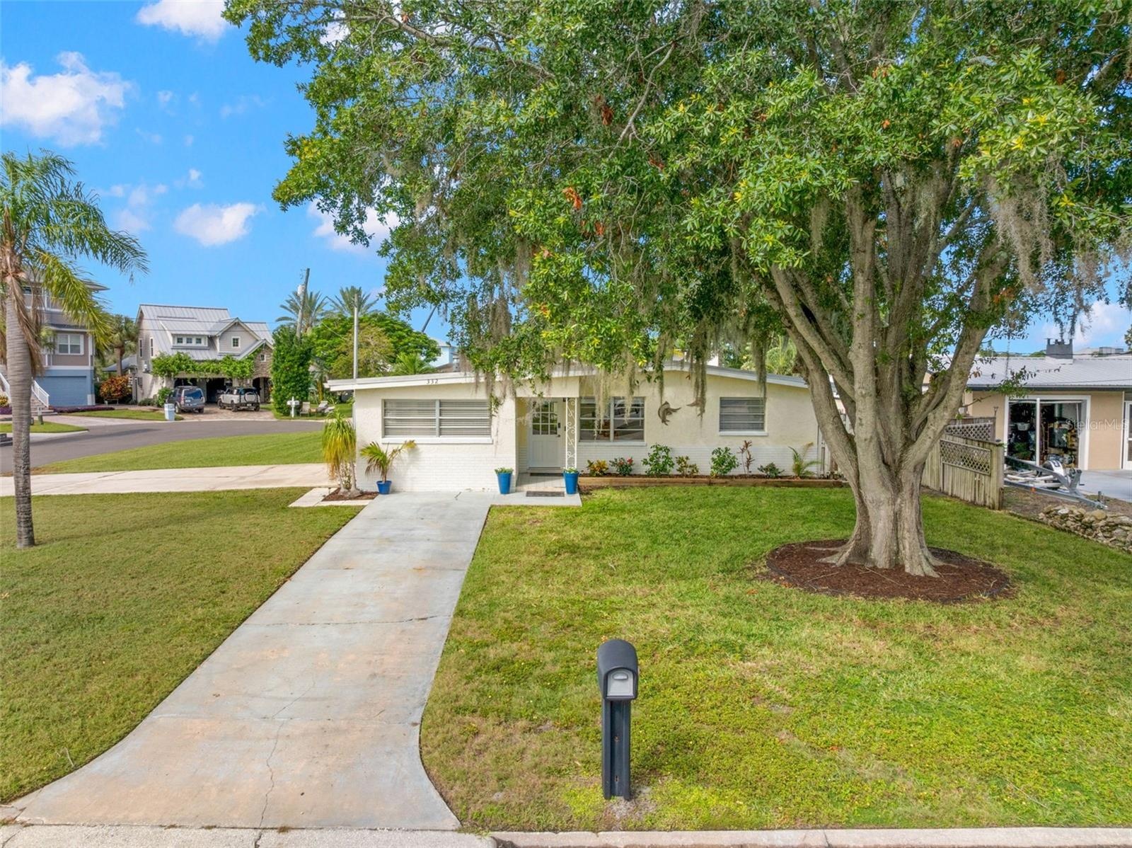Set on a generous 11,800-square-foot corner property at the end of a cul-de-sac, the home enjoys a broad front lawn, mature shade tree, and plenty of 