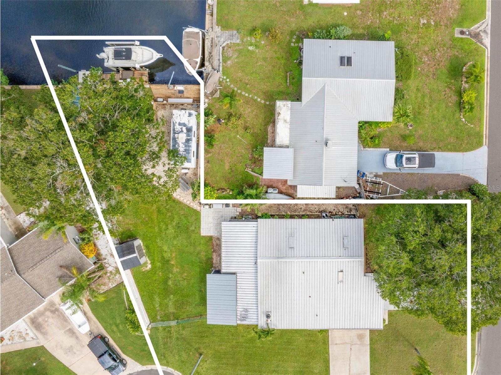 A straight-down aerial view highlights the property from street to canal, showing the generous yard, long driveway, screened lanai, RV parking area, a