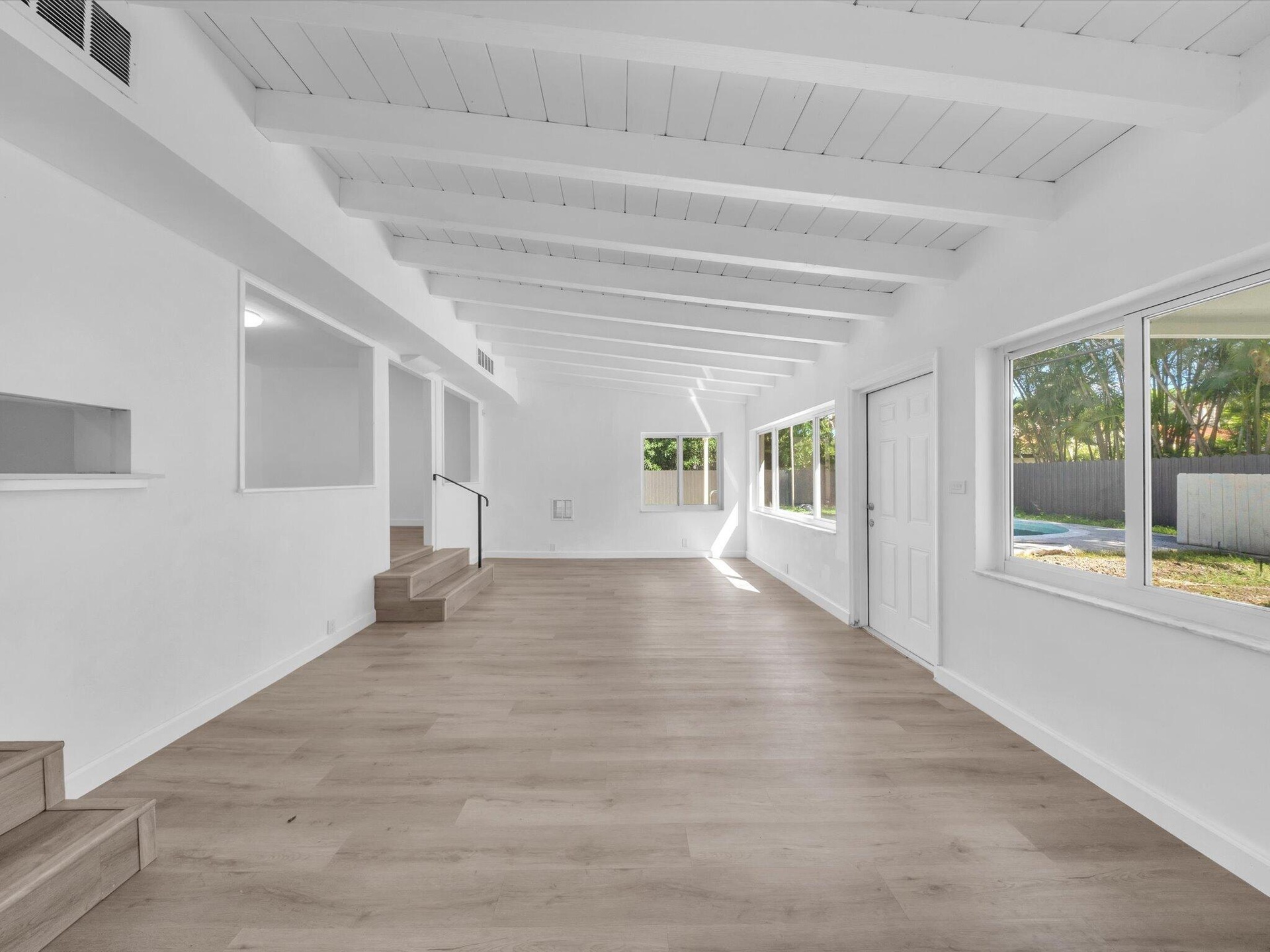 FAMILY ROOM WITH VIEW TO POOL