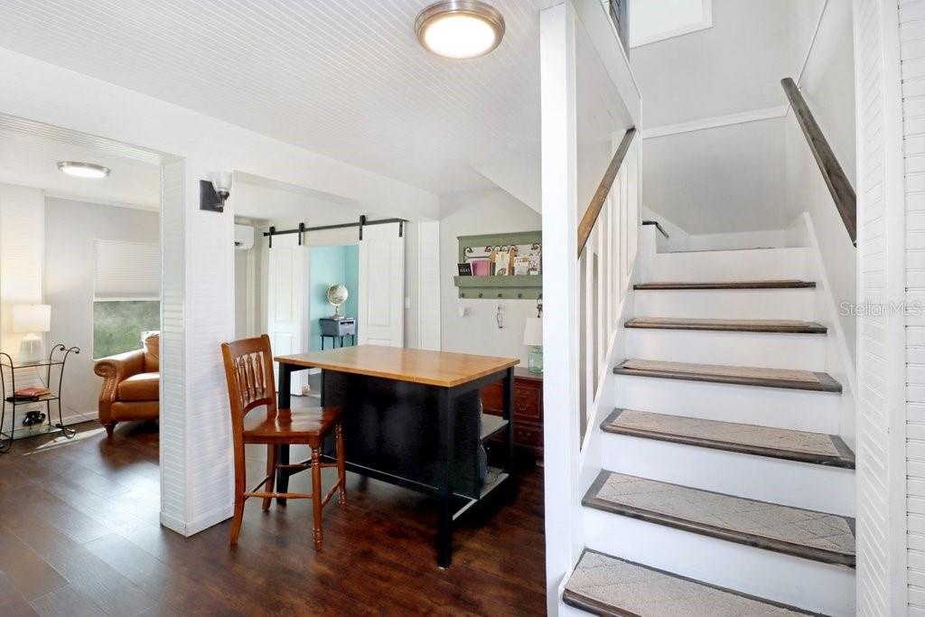 Down stairs to a secondary living space with Bedroom 3 and Primary Bedroom