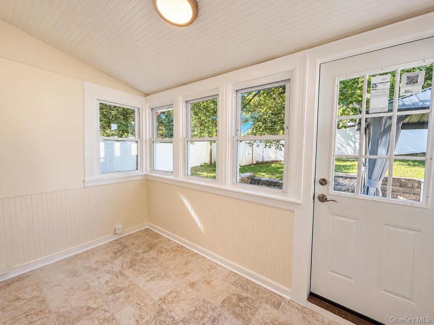 Beautiful room for many occasions, lots of windows, door leading out to the patio.