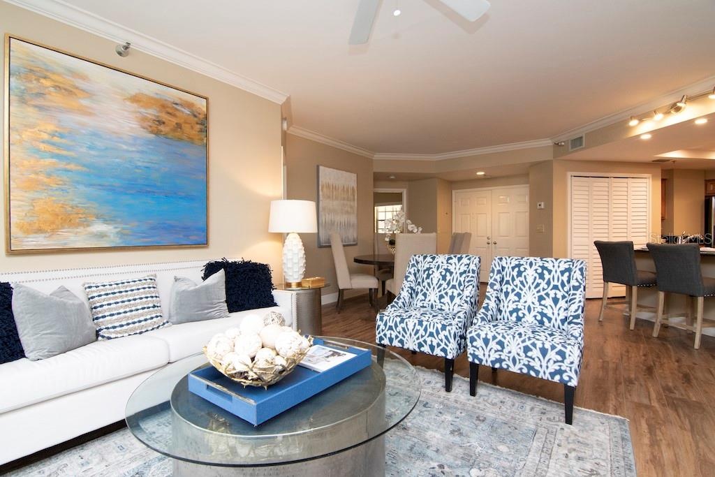 Recent tasteful upgrades include gorgeous new flooring, smooth ceilings, crisp crown and base moldings, new interior doors and hardware, fresh window 