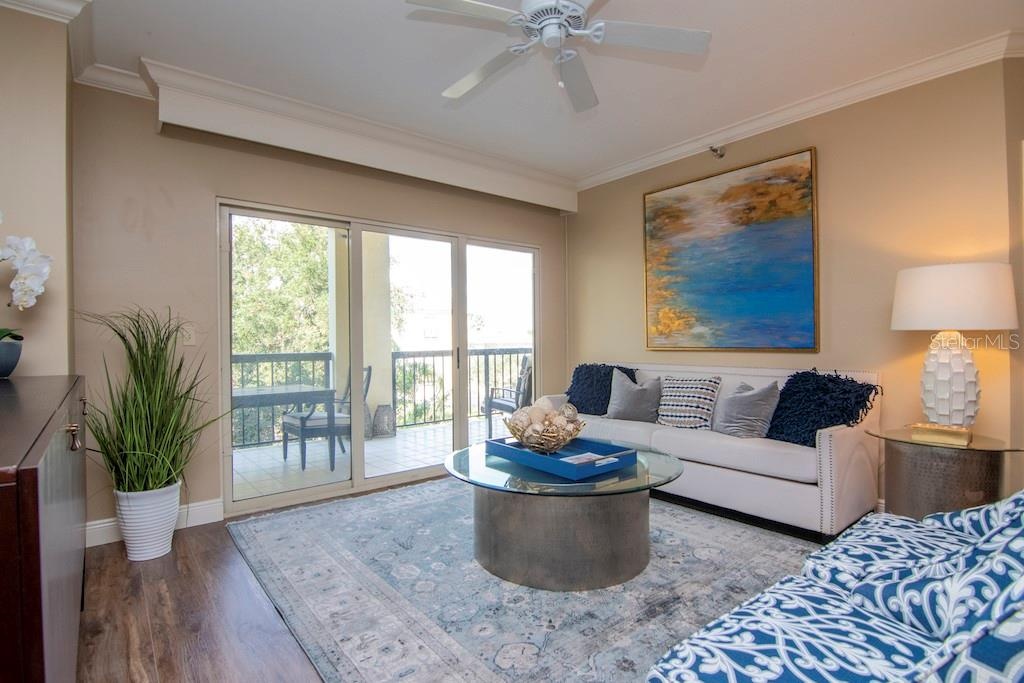 Natural light fills the open living spaces and flows onto an expanded balcony offering morning sun and serene evenings, accessible from the living roo