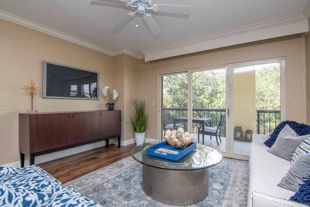 Natural light fills the open living spaces and flows onto an expanded balcony offering morning sun and serene evenings, accessible from the living roo