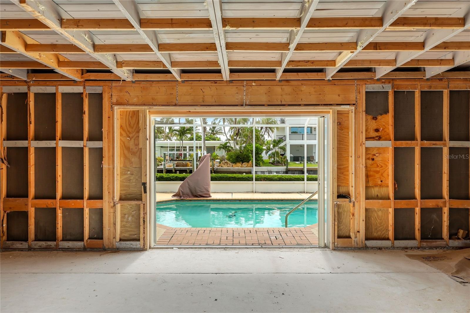 View from the front entry area to the pool and on out to the dock and canal