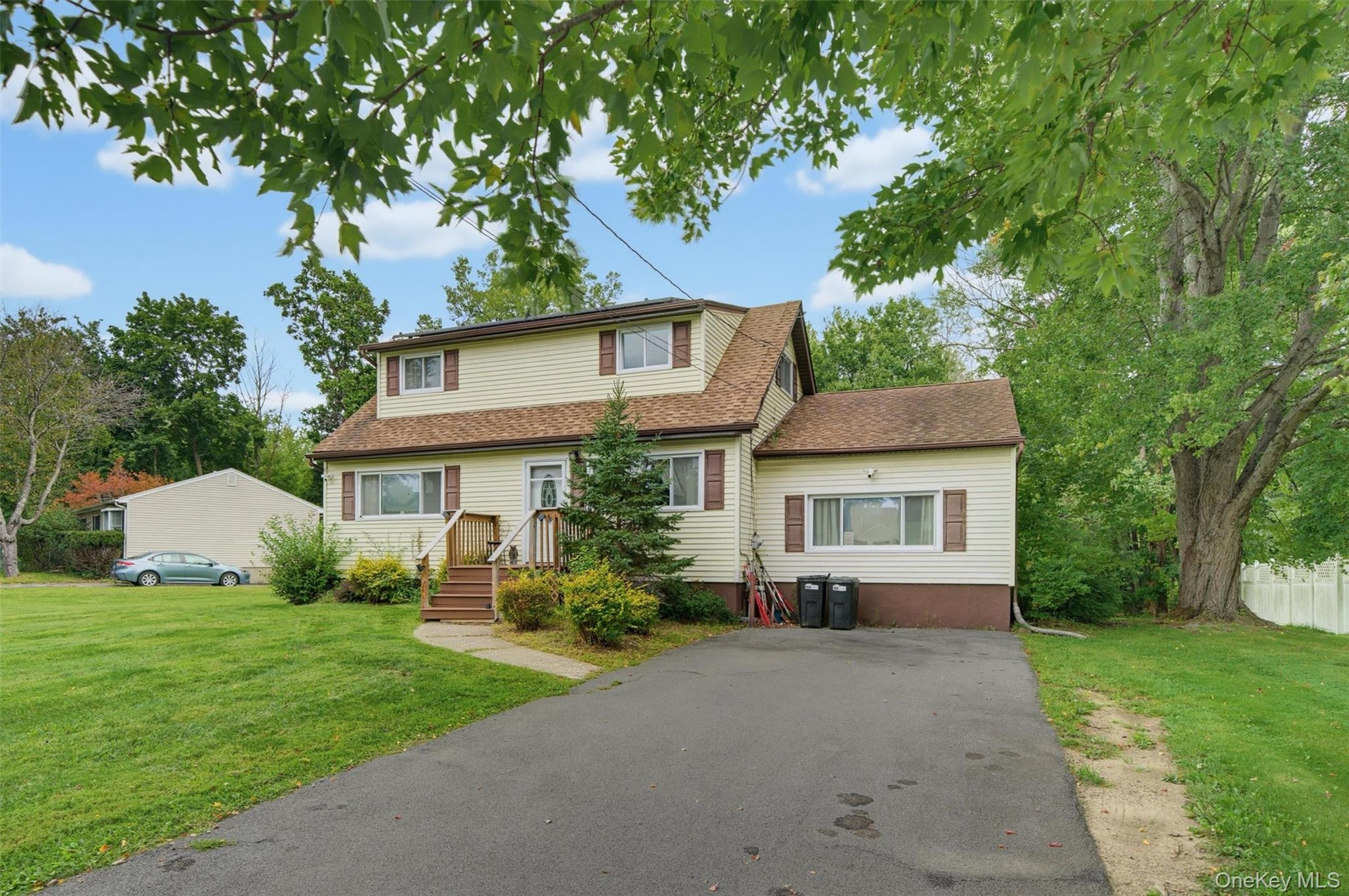 Front exterior and front entry, driveway and landscape