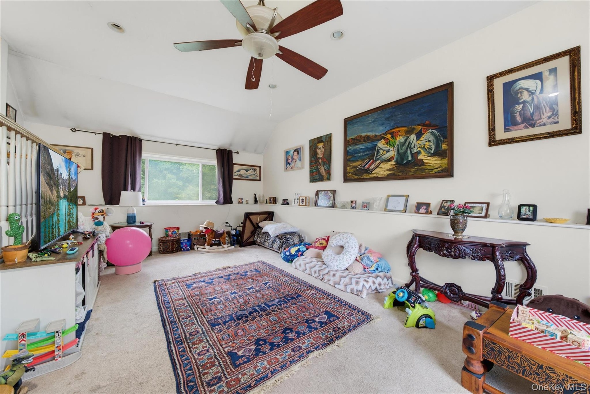 Carpeted flooring with a white sloped ceiling, recessed lighting, and a ceiling fan