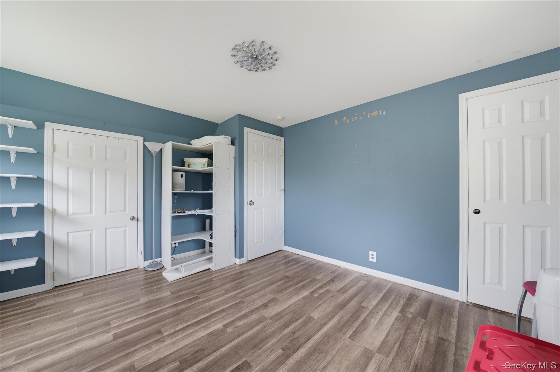 Wood-finish flooring with light blue wall paint