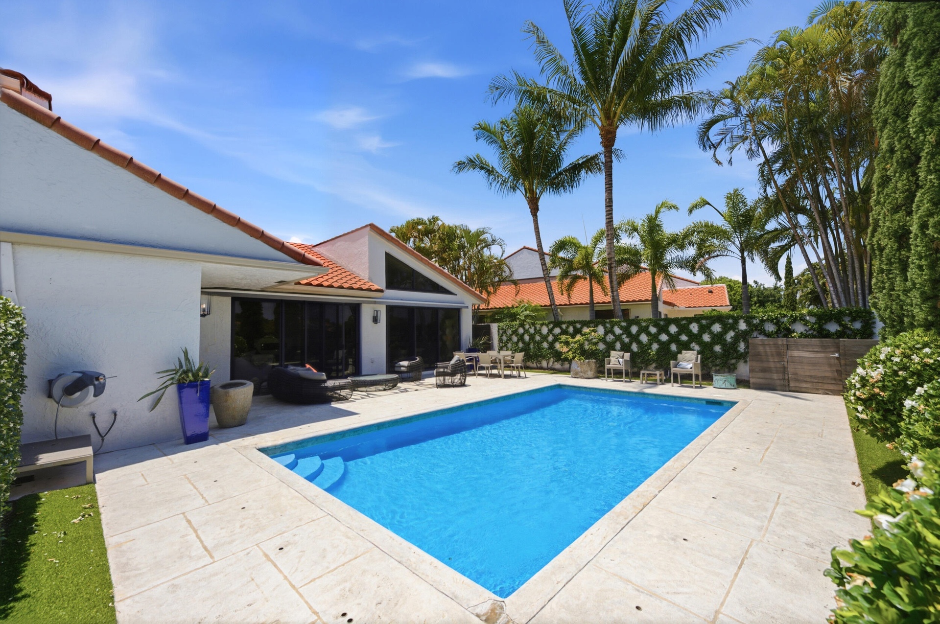 Outdoor living space with pool perfect for off-season stay in Palm Beach Polo