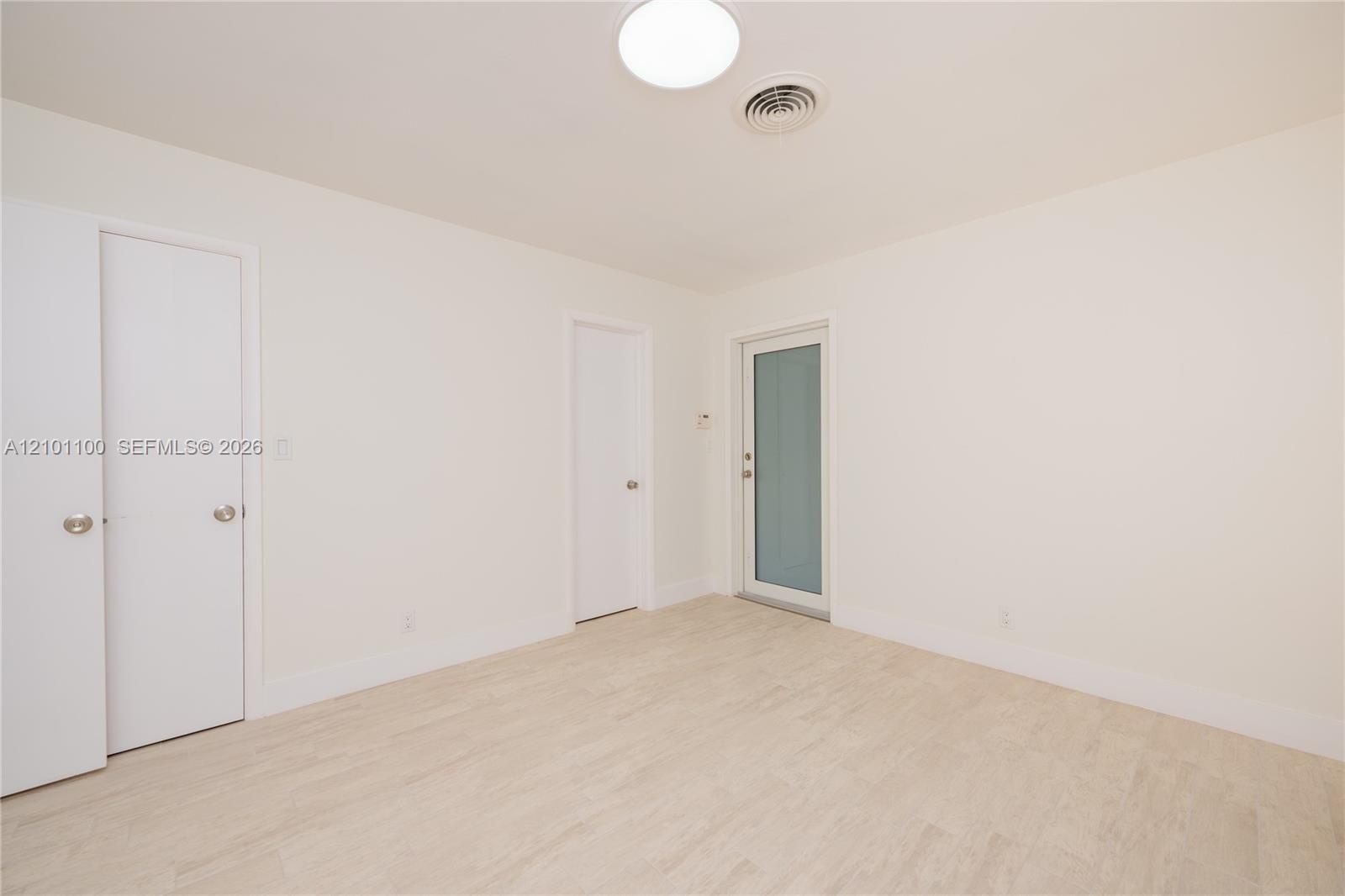 Large Master Bedroom/w a door to the Back Yard